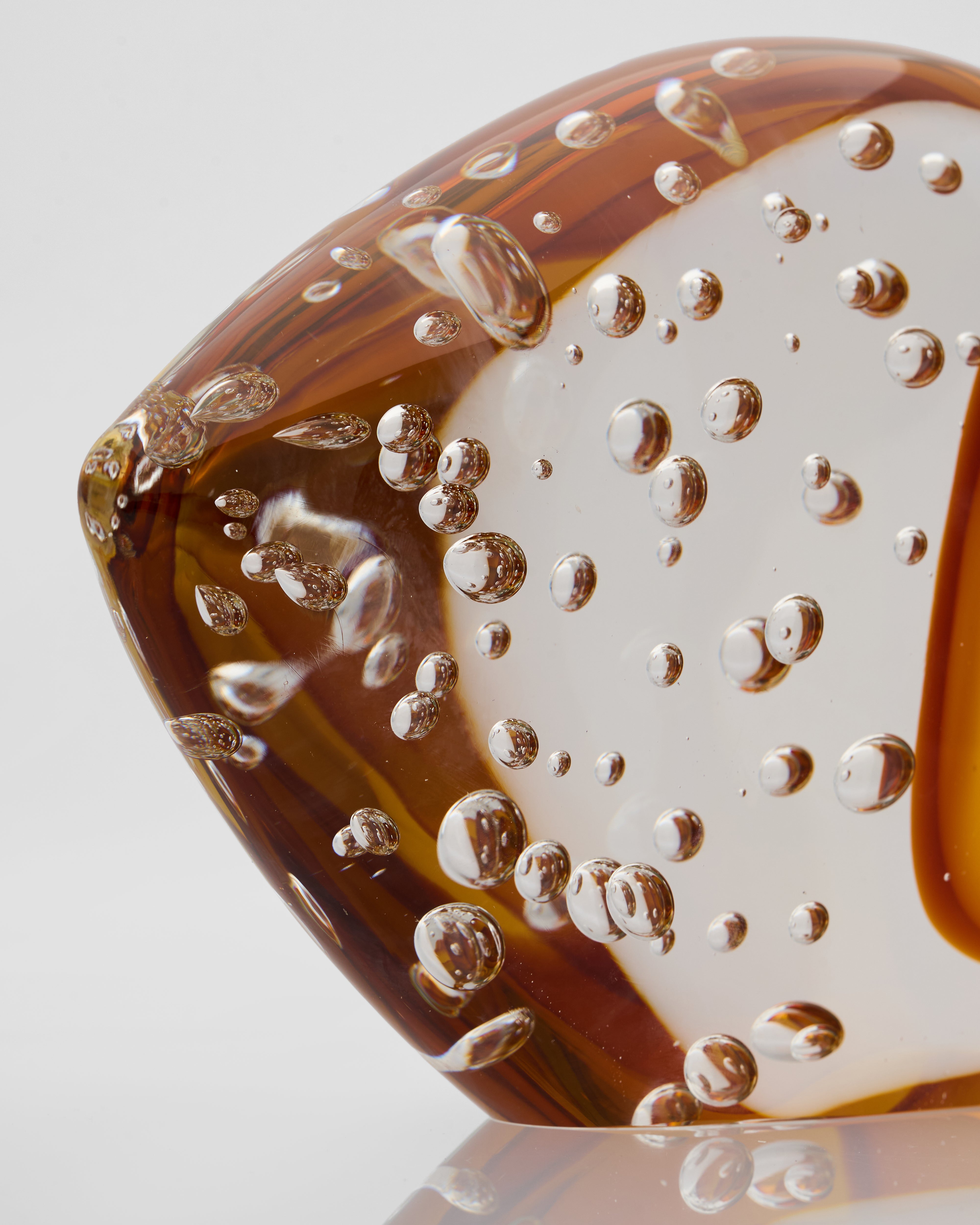 Close-up of transparent fish decor revealing crystal-clear glass texture and fine sculptural detailing