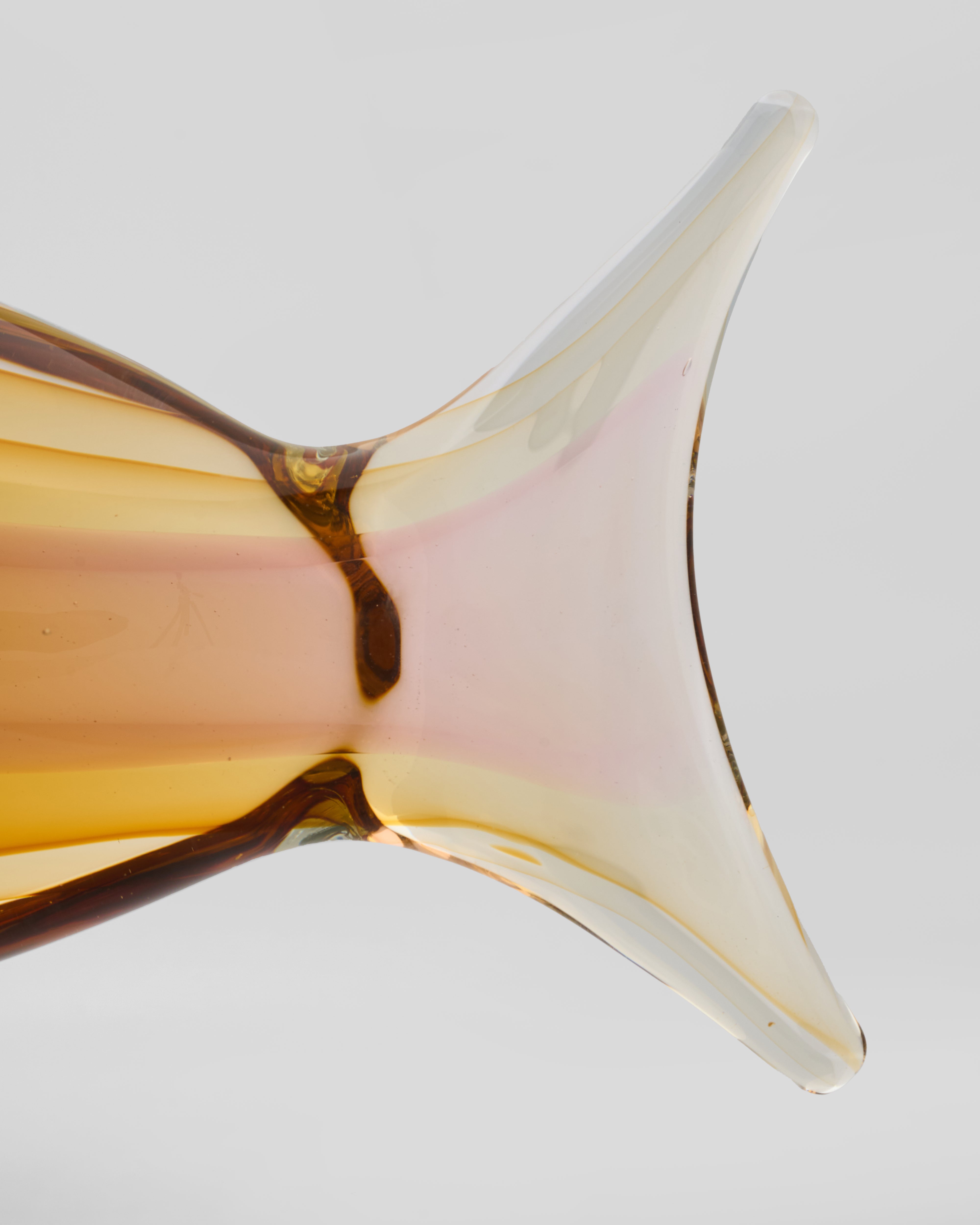 Glass object with a unique design on a light gray background