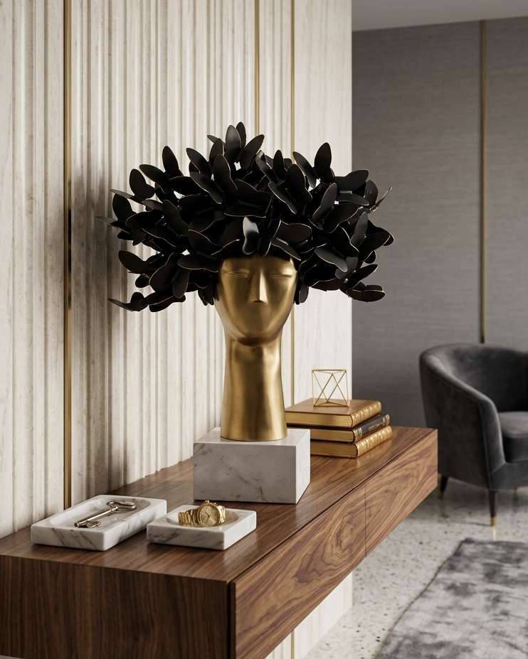Decorative wall shelf with a gold vase and black foliage in a modern interior setting.