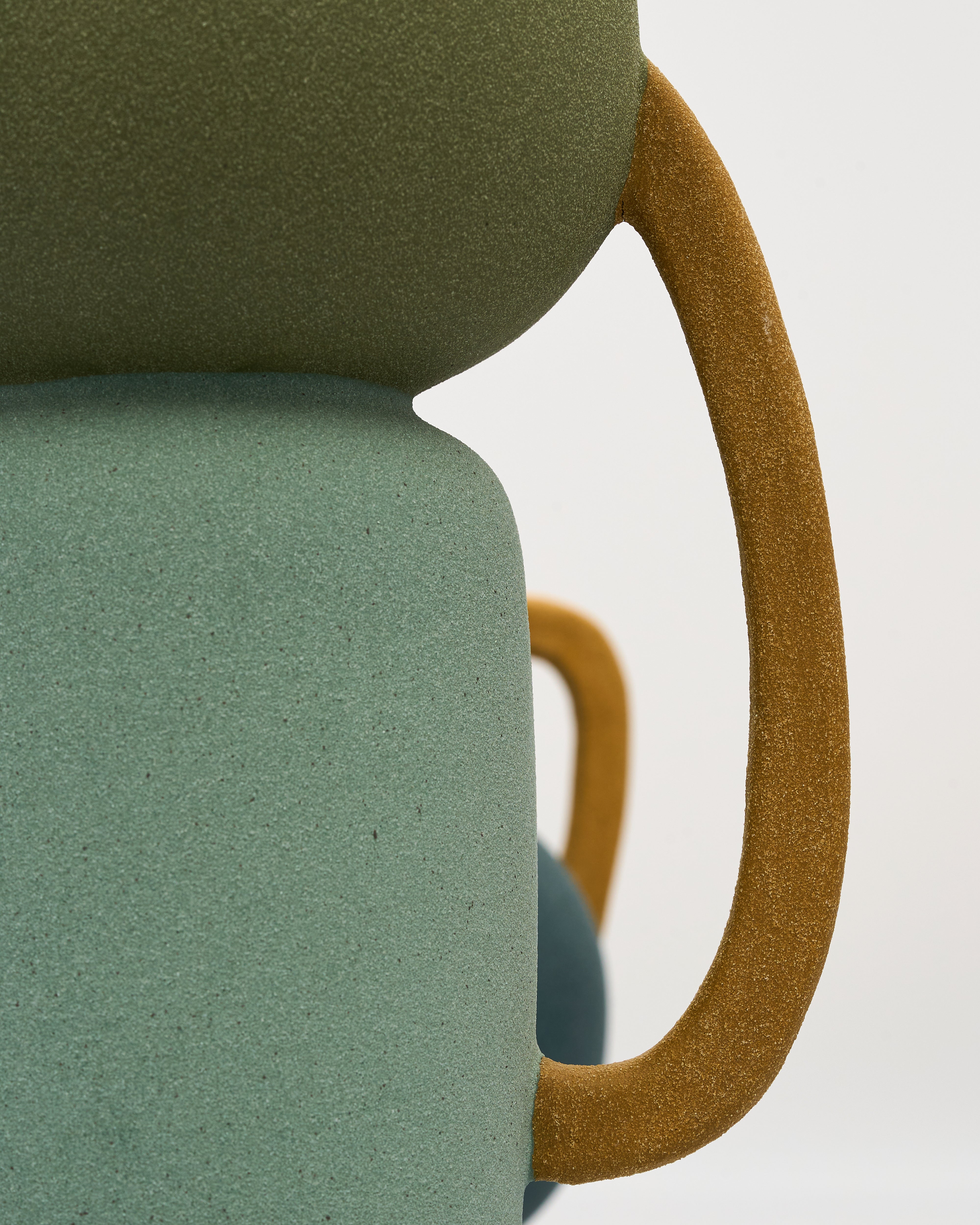 Close-up of tumbler form ceramic decor highlighting fine ceramic texture and elegant finish