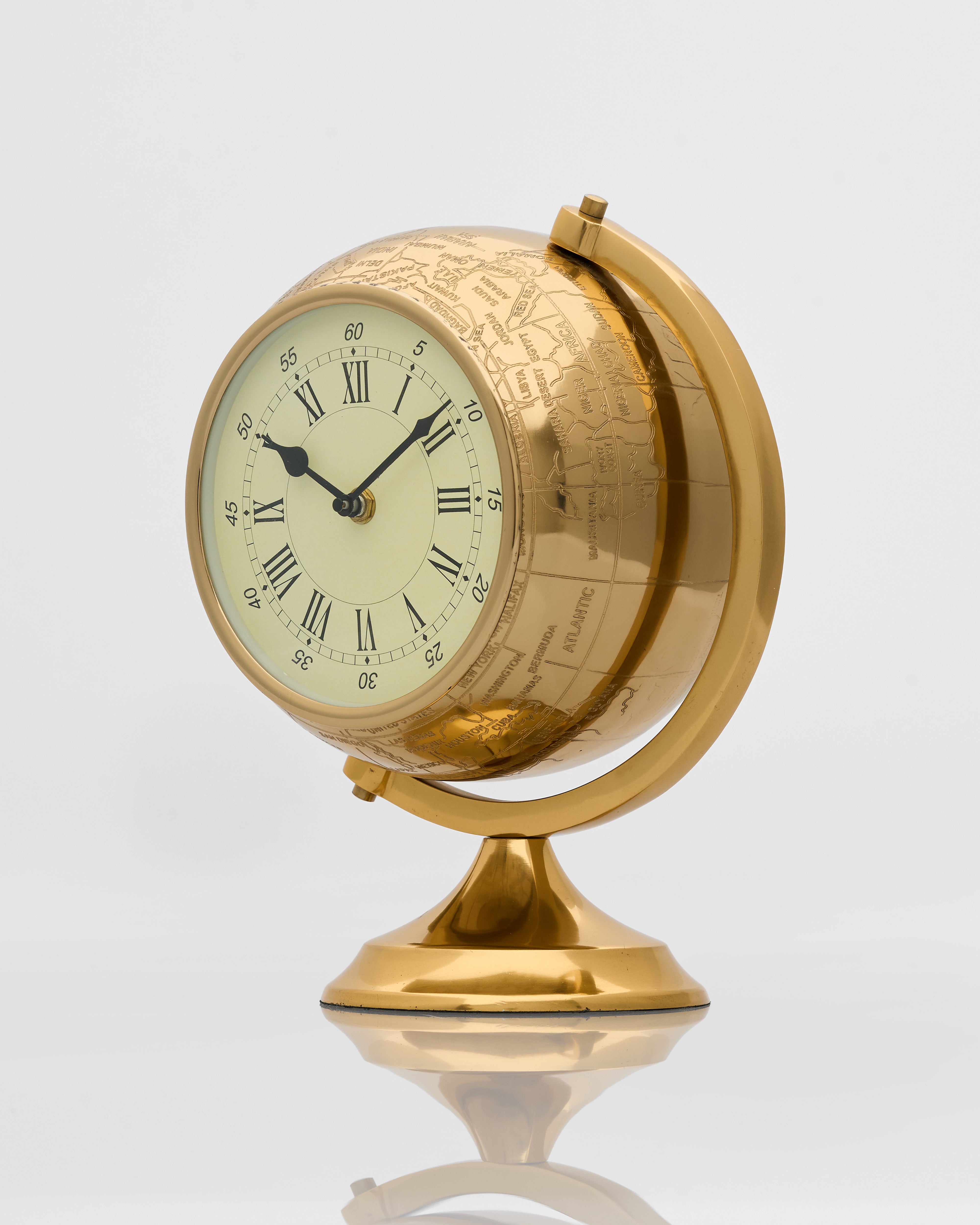 Side view of vintage globe inspired table clock highlighting elegant form and antique style detailing