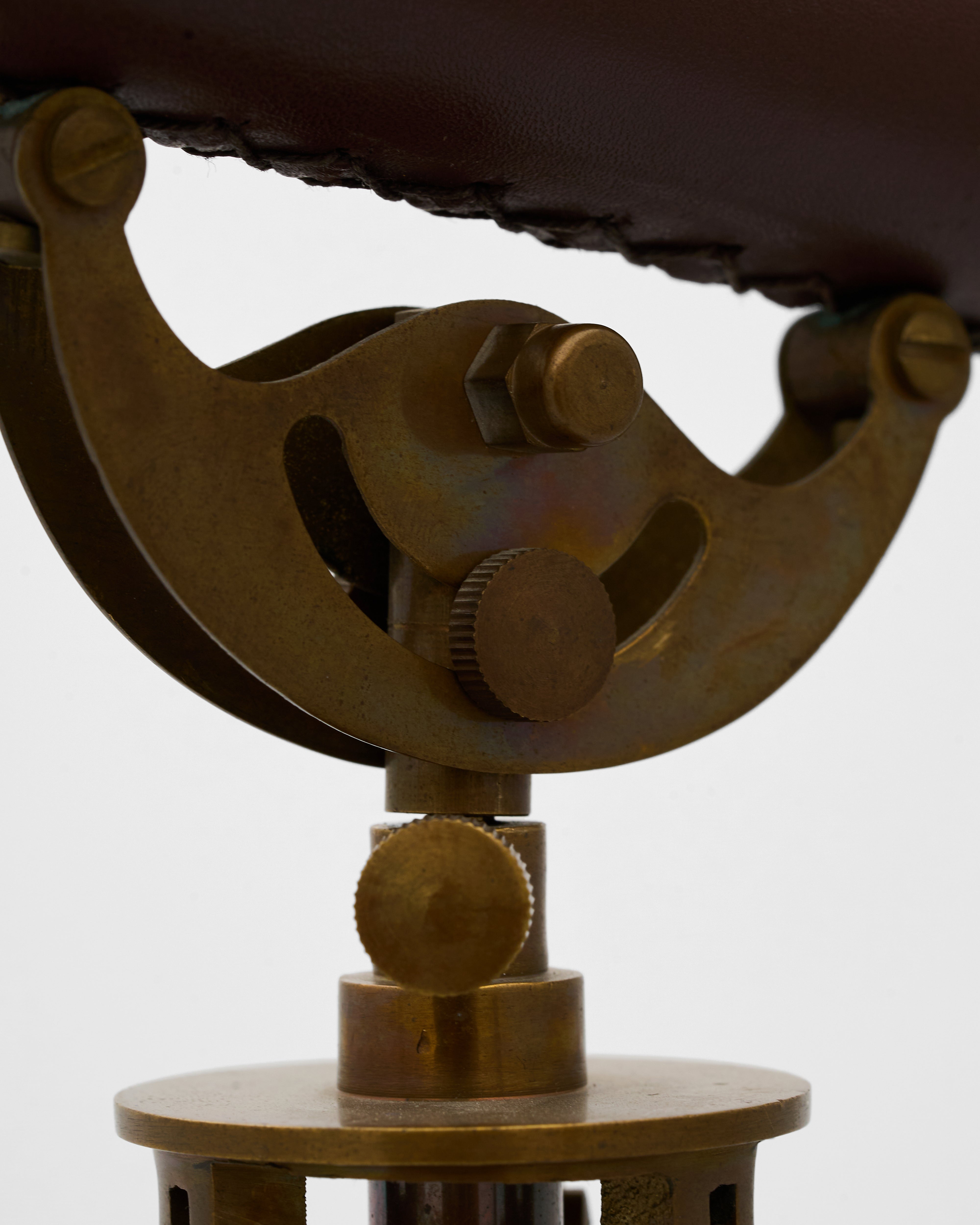 Bronze telescope model on a white background