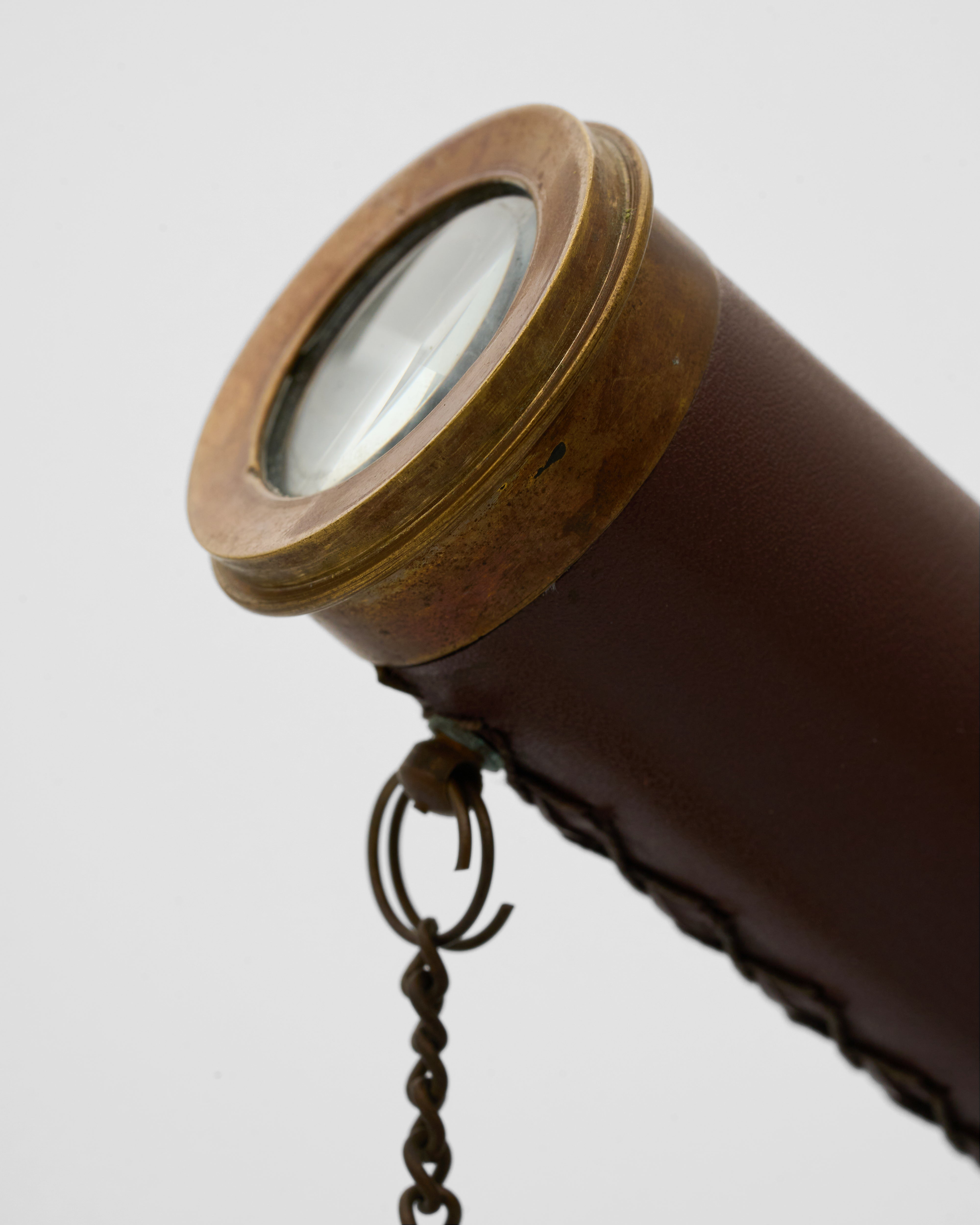 Detailed view of vintage joint telescope emphasizing precision detailing and luxury antique finish