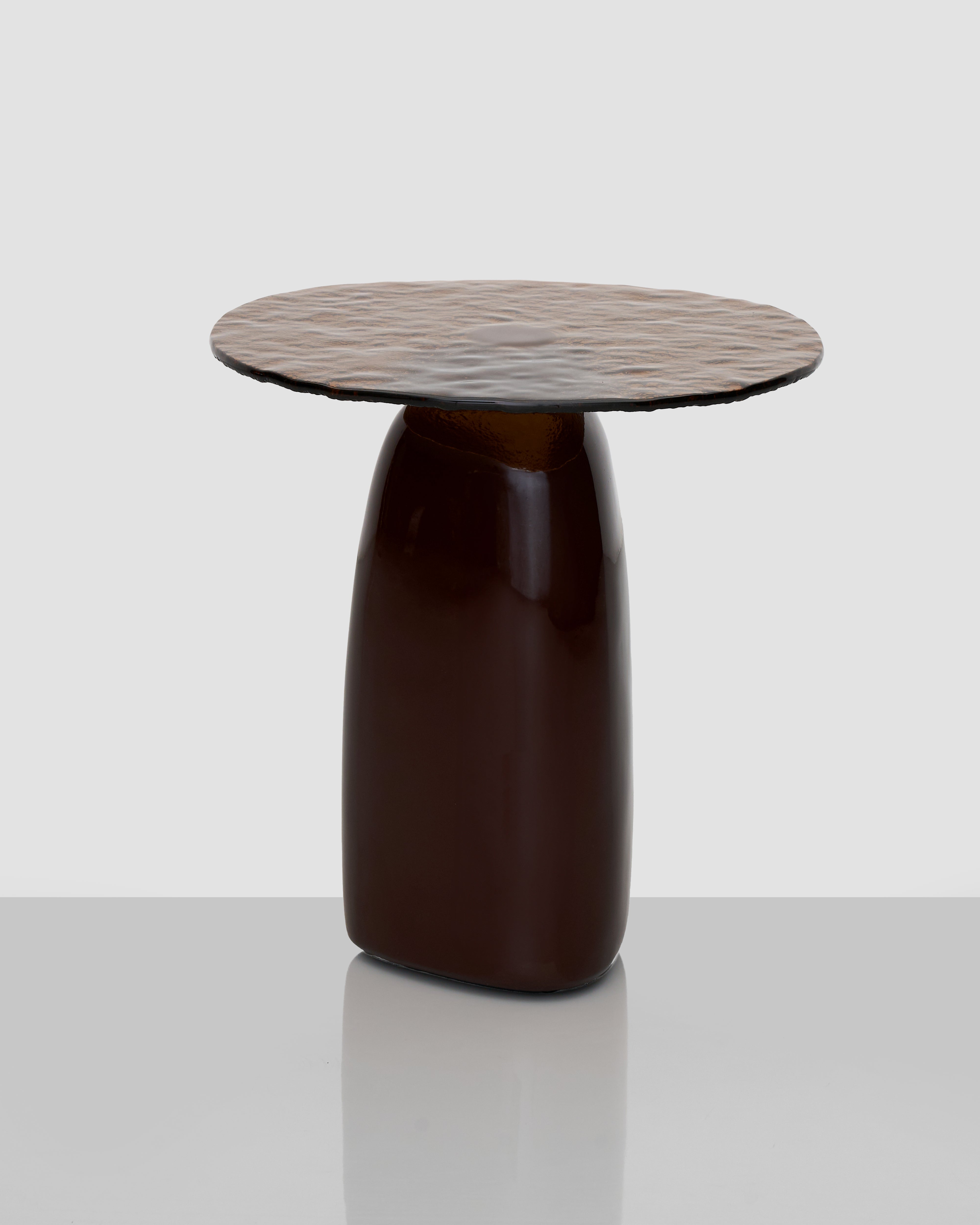 Wave Marble Side Table angled view showing wave-inspired design and premium marble finish with glass accents