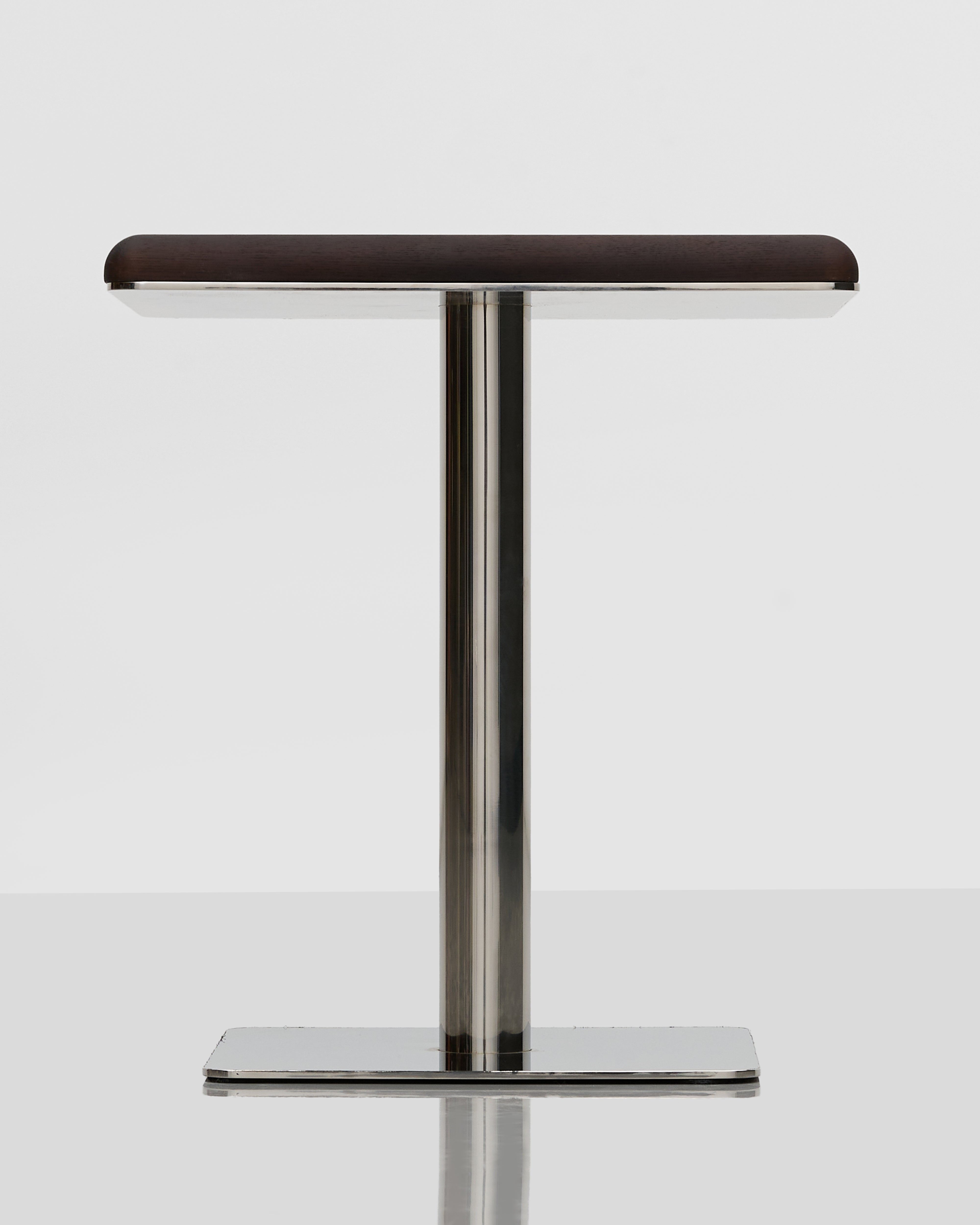 Bar stool with wooden seat and metal legs on a white background