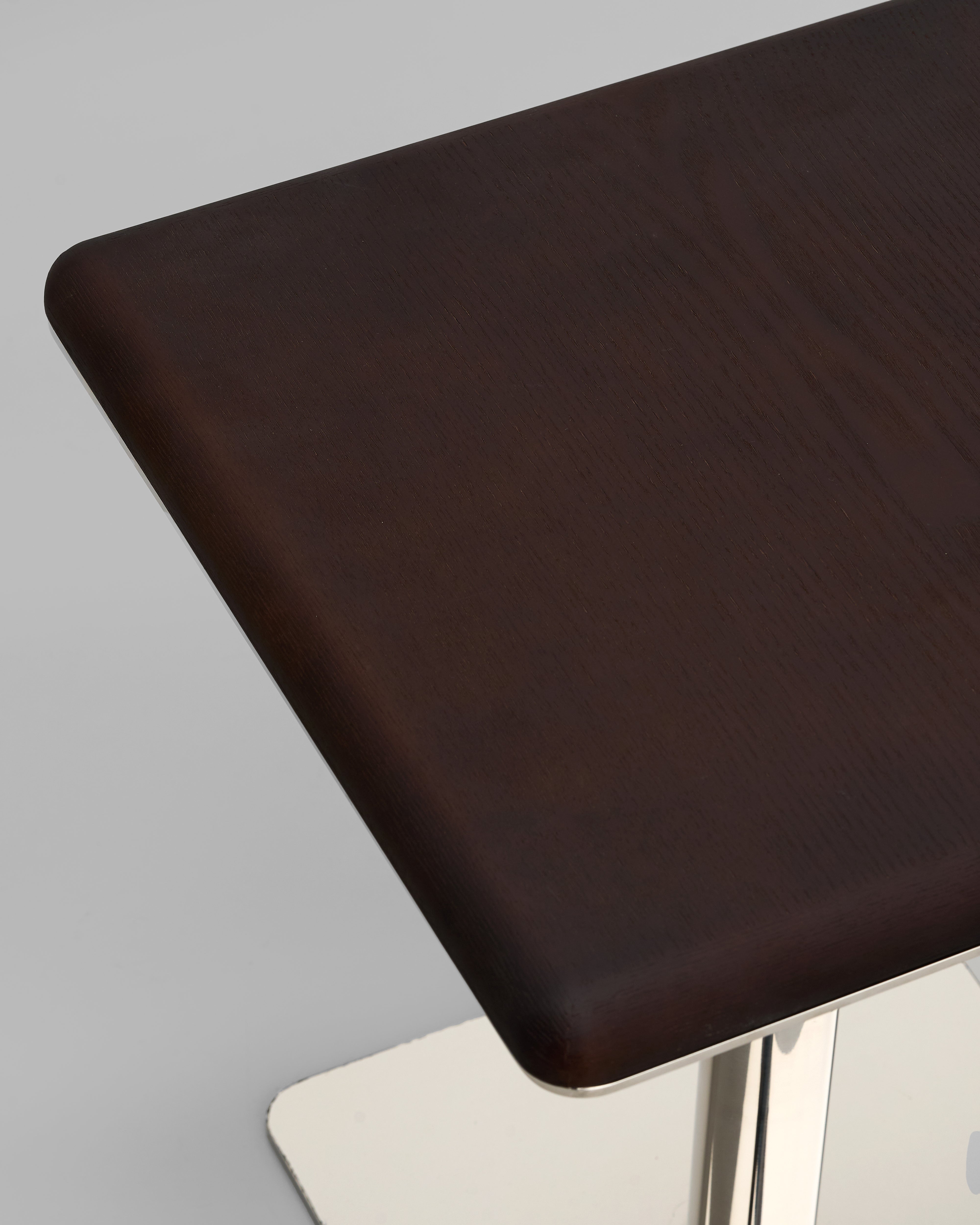 Detailed view of wooden base side table highlighting smooth edges and refined finishing