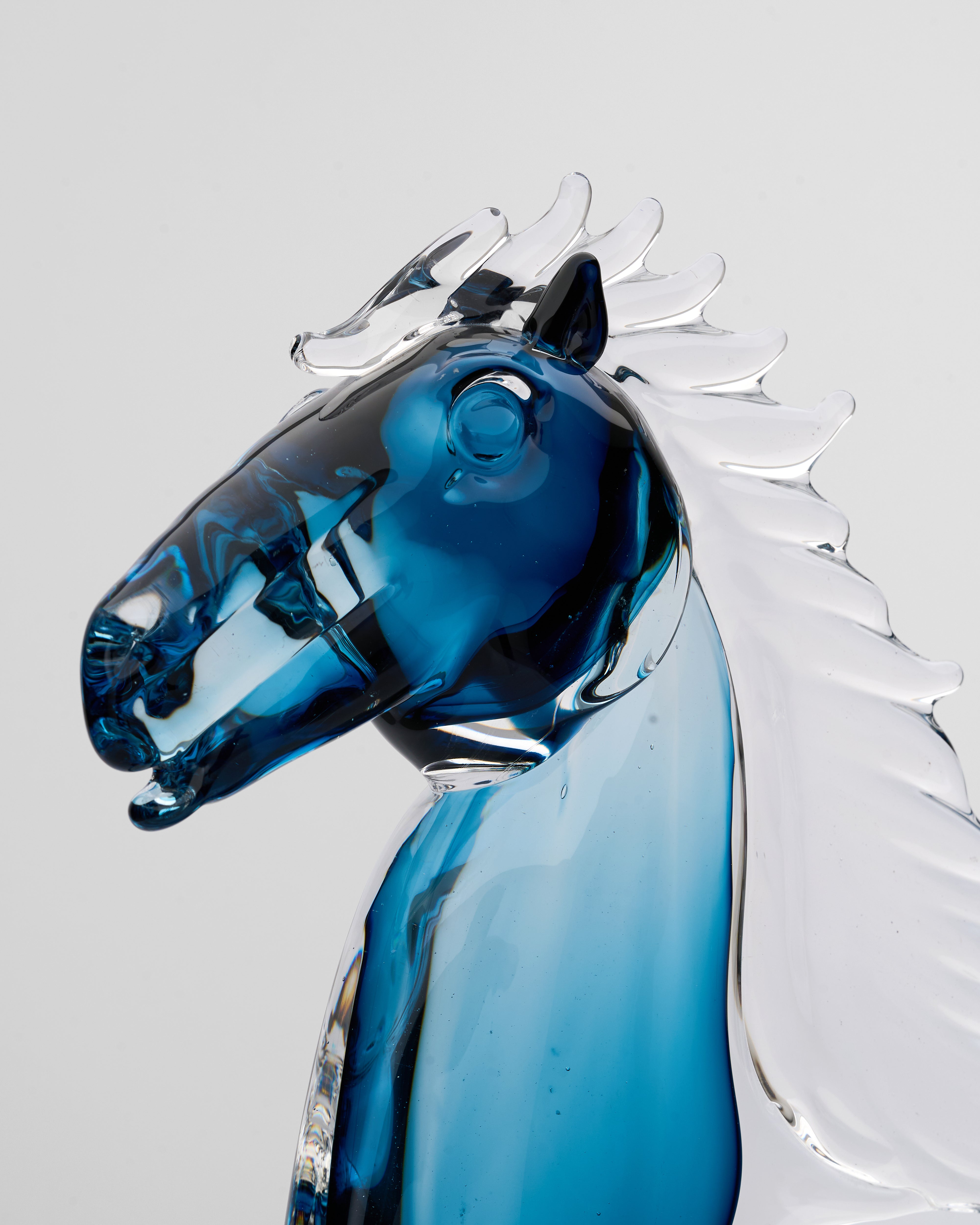 Close-up of Zaphire blue clear horse decor revealing smooth glass texture and premium detailing