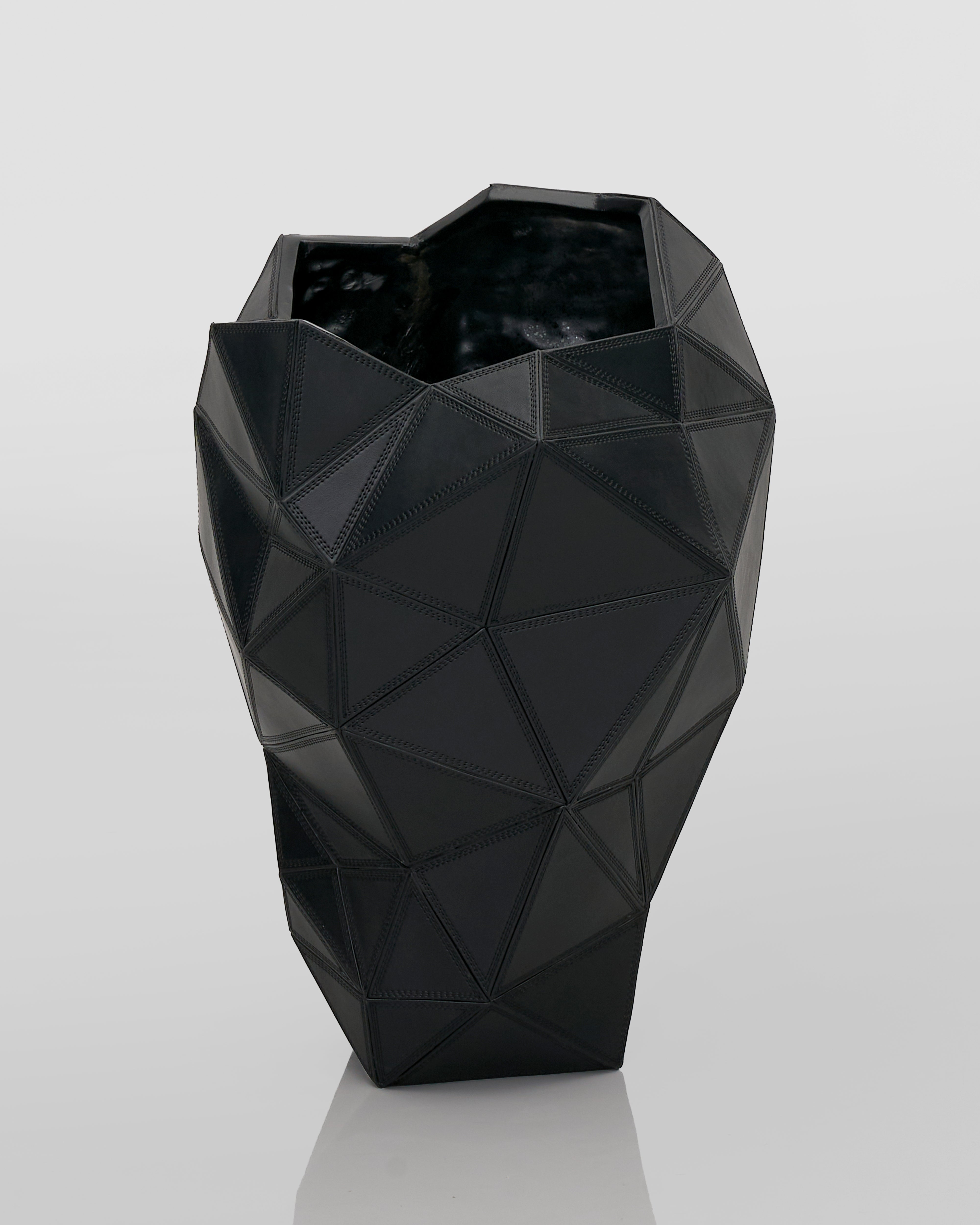 Black geometric vase on a light gray background