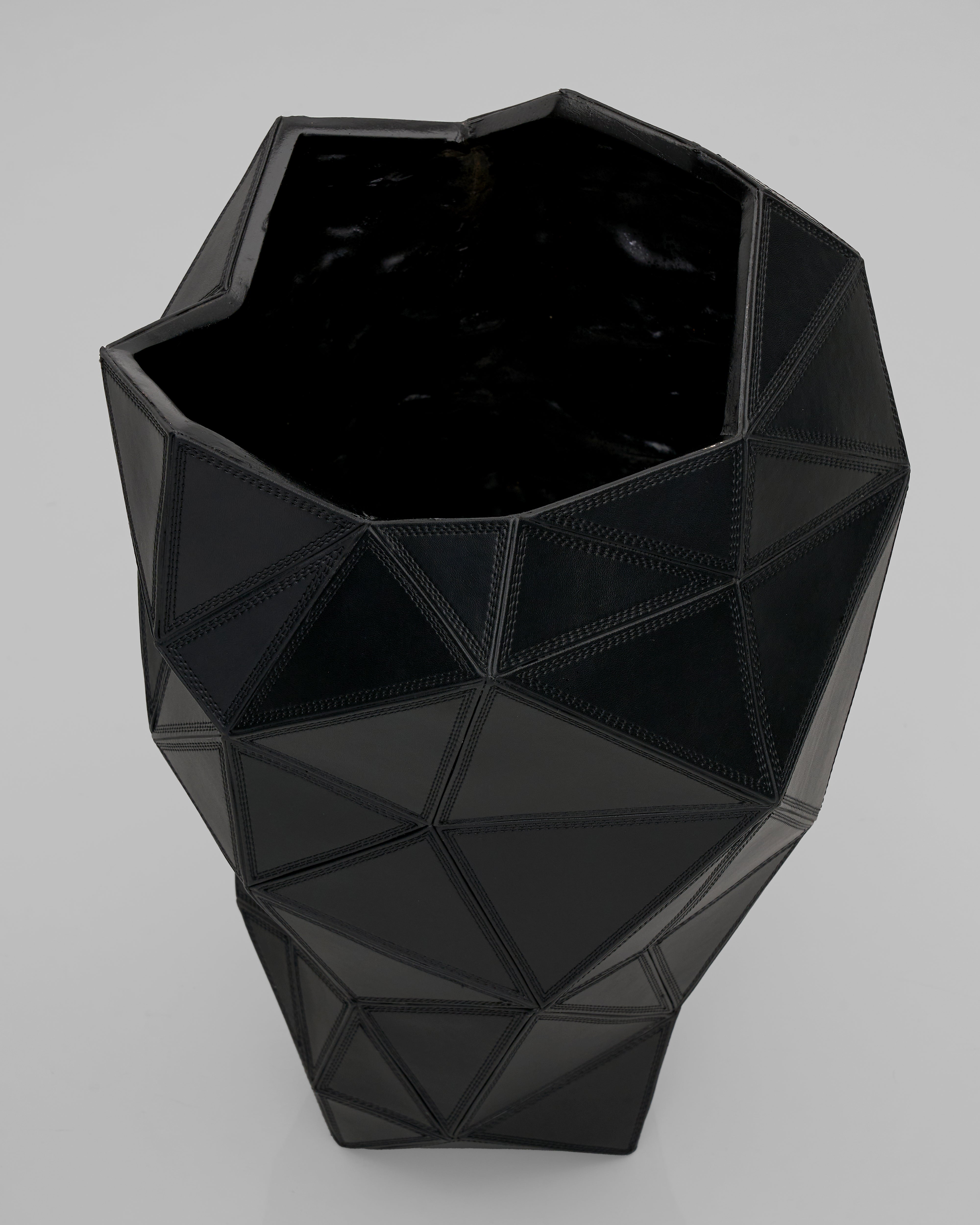 Black geometric vase on a light gray background