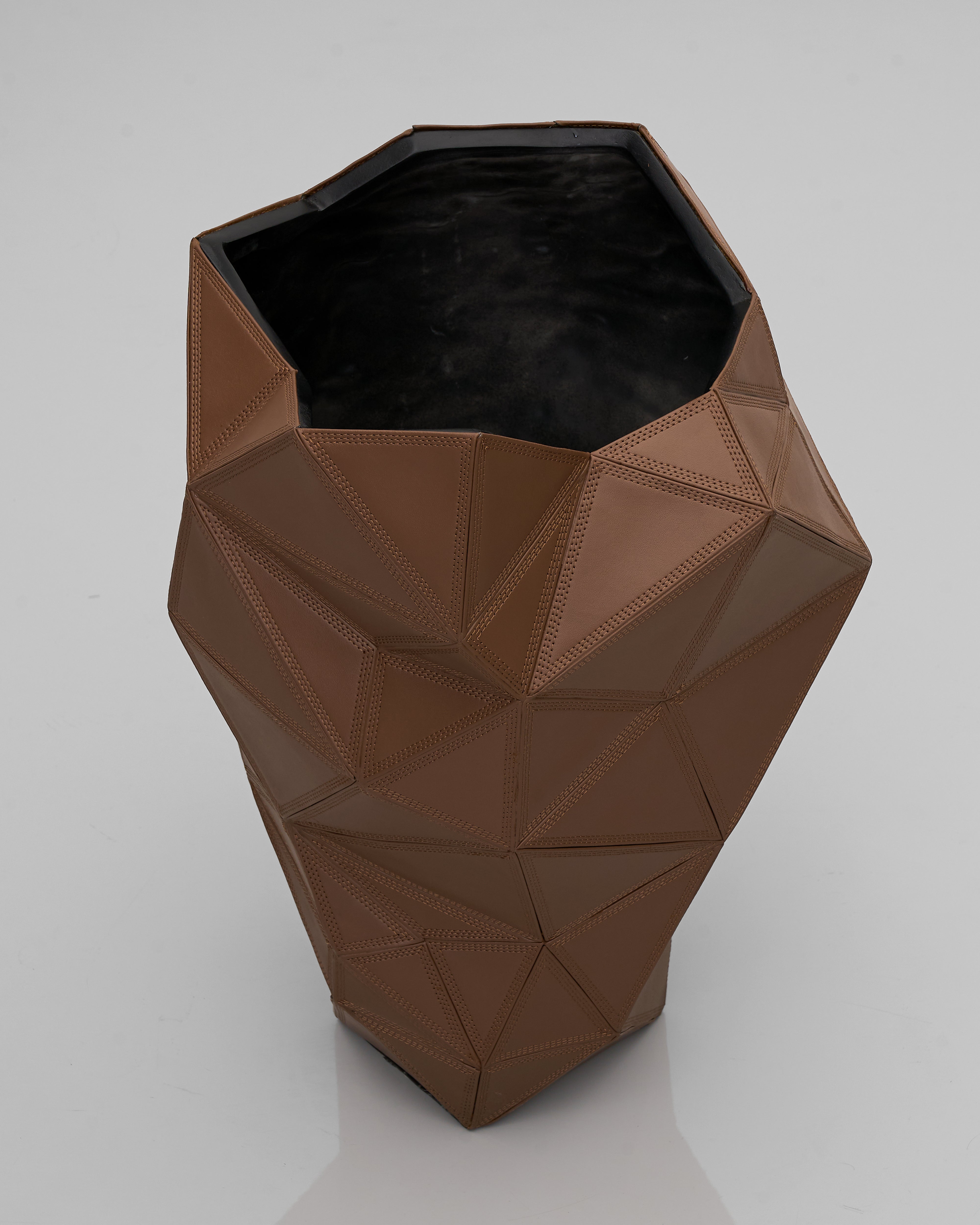 Brown geometric vase on a white background