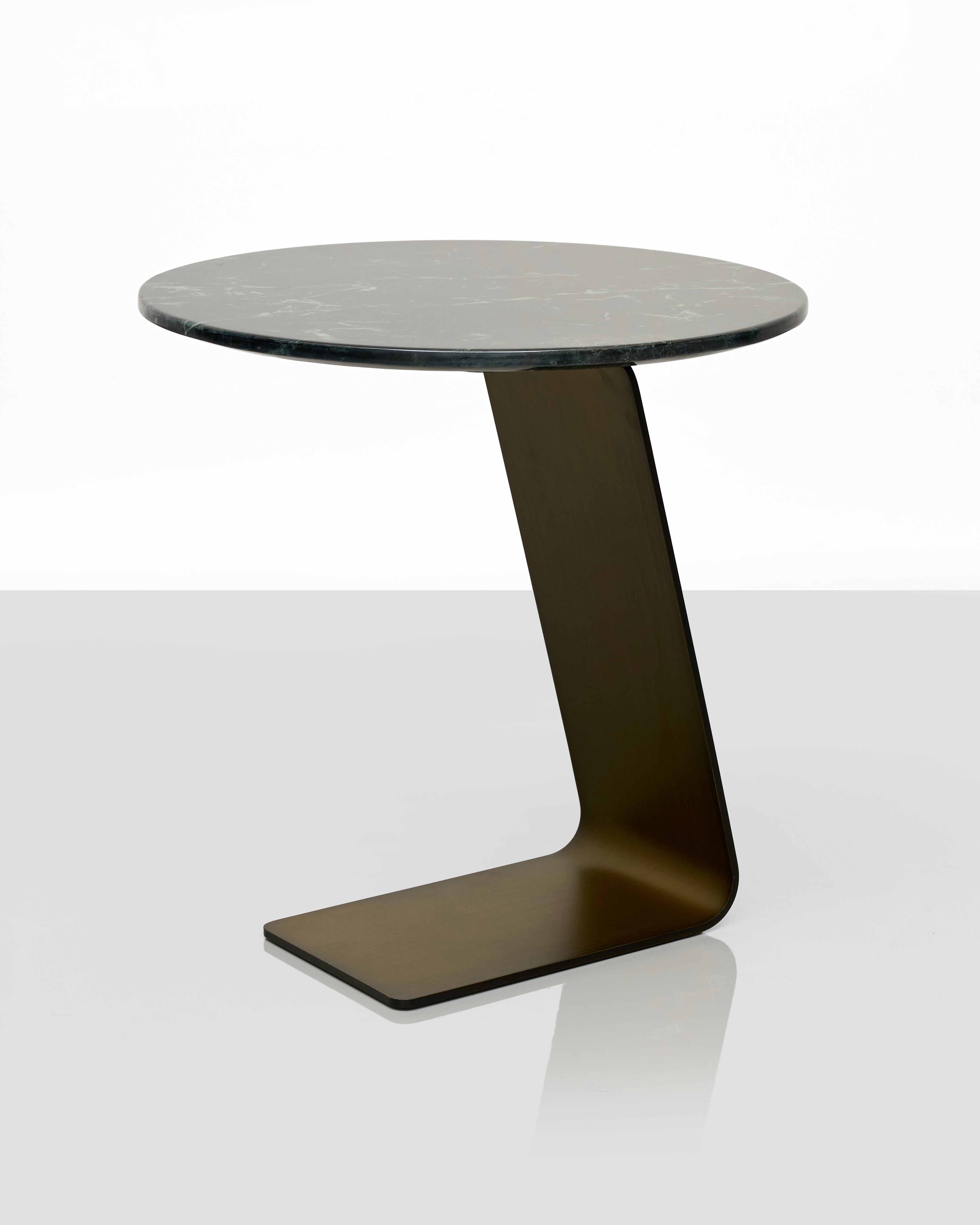 Modern side table with a black marble top and base on a white background