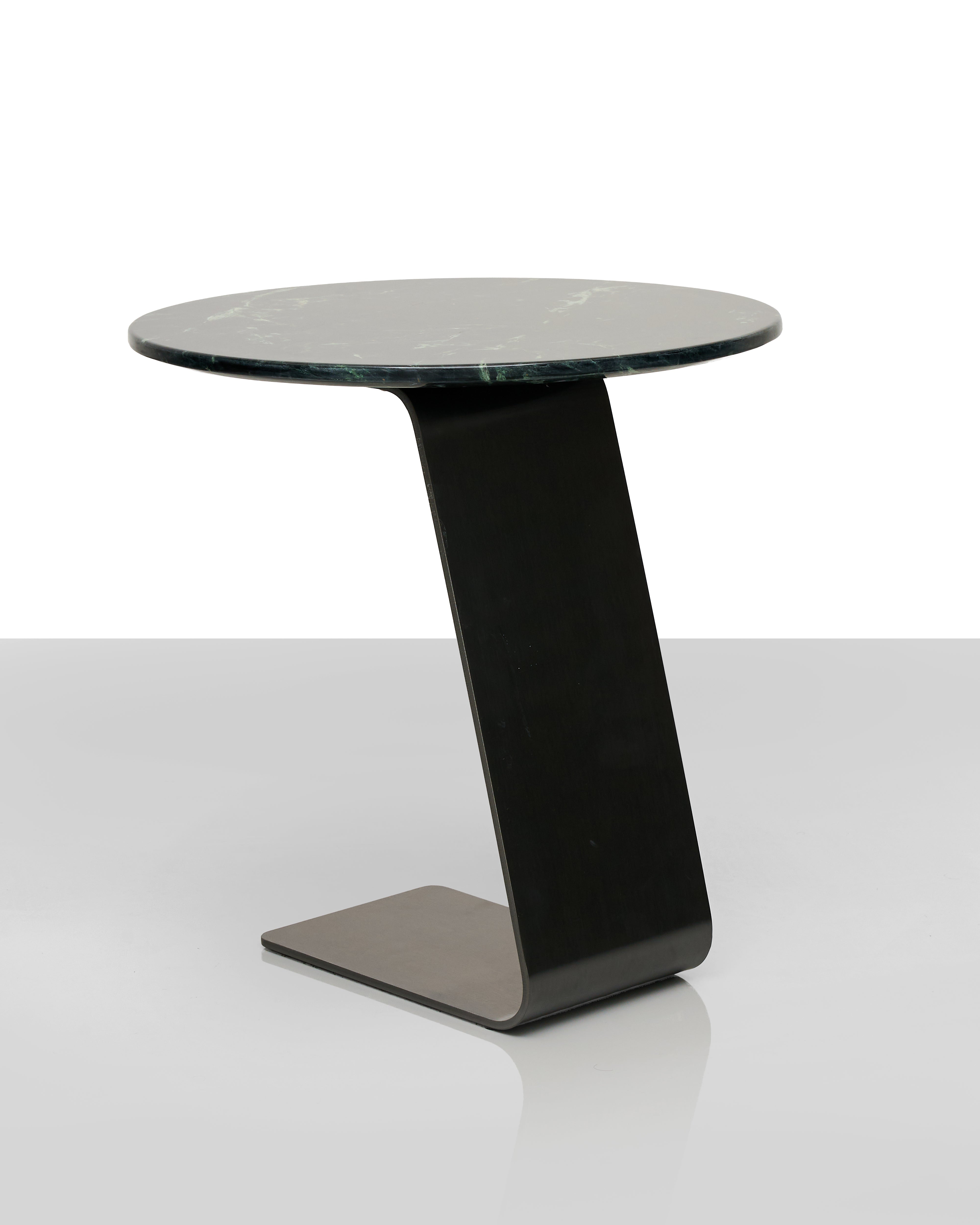 Modern side table with a black marble top and base on a white background