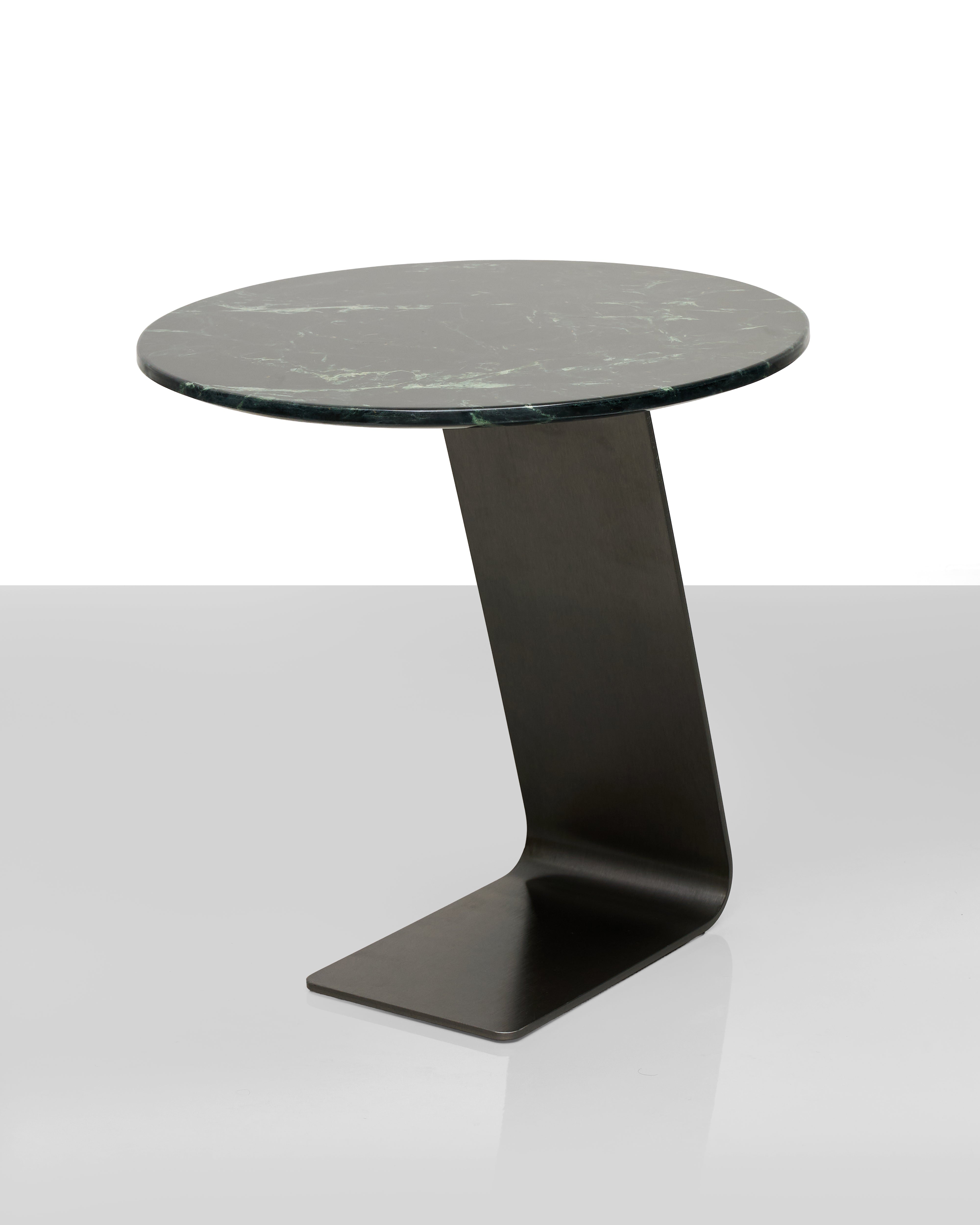 Modern side table with marble top and black metal base on a white background