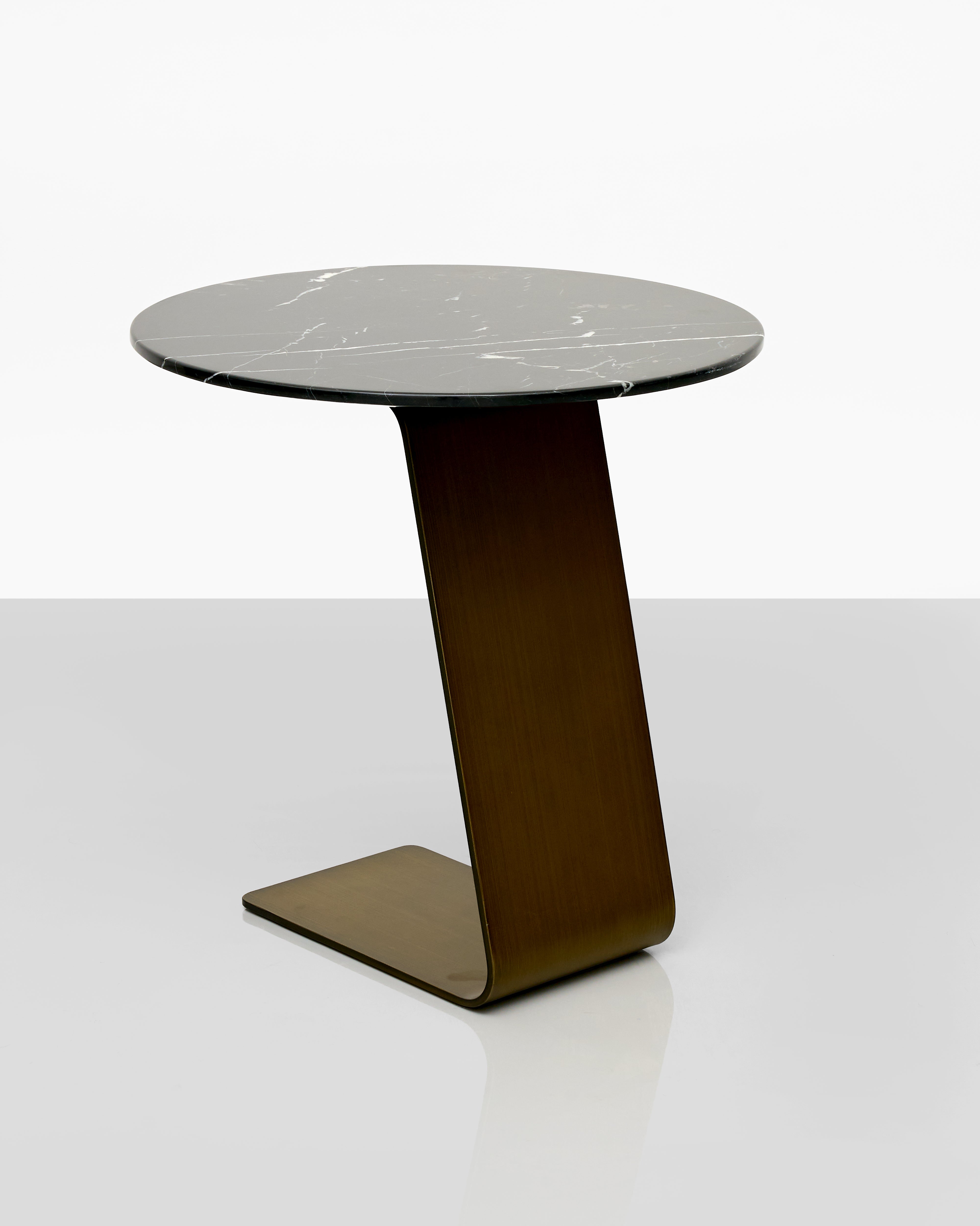 Modern side table with a marble top and wooden base on a white background