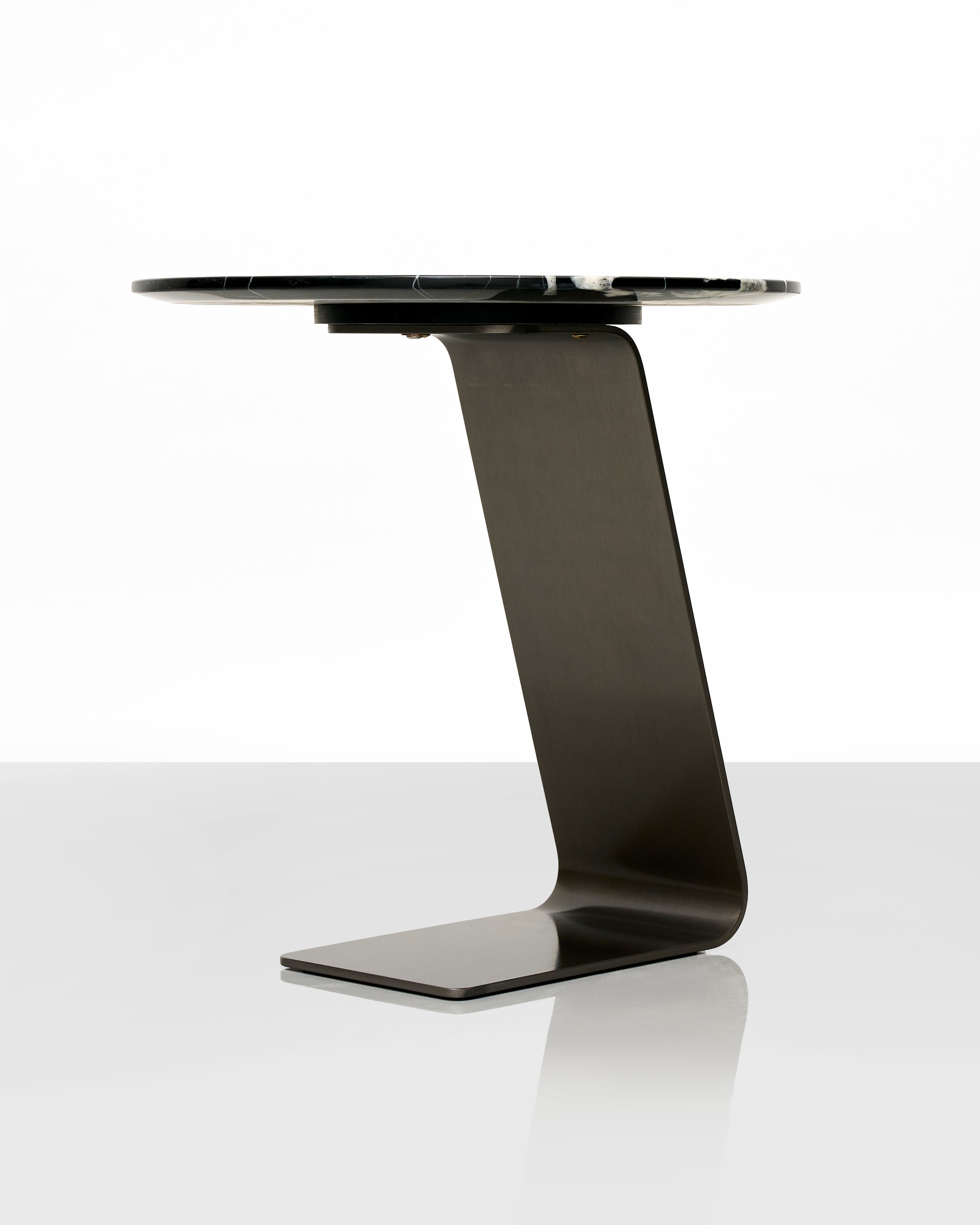 Modern black side table with a minimalist design on a white background