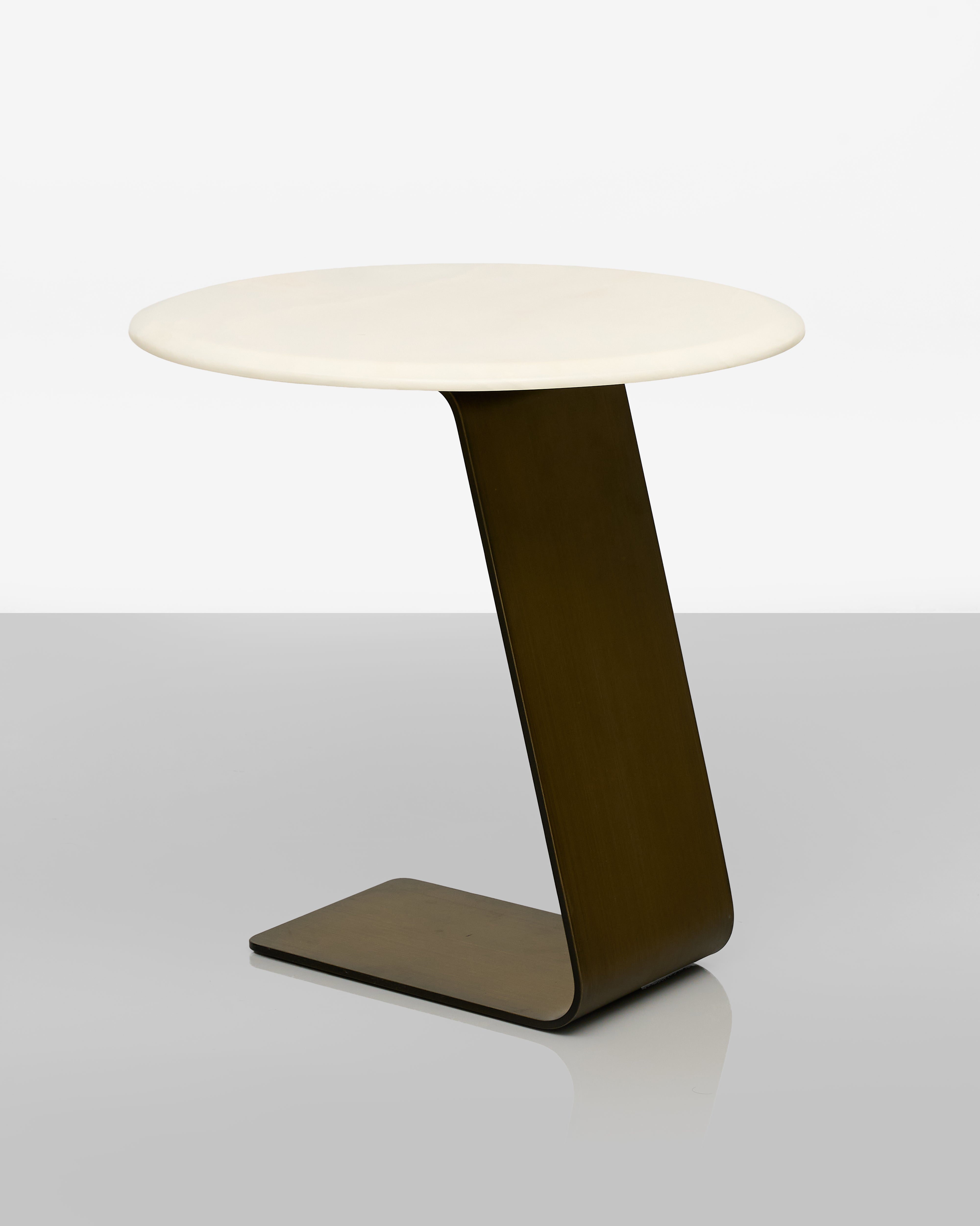 Modern side table with a white top and brown base on a white background