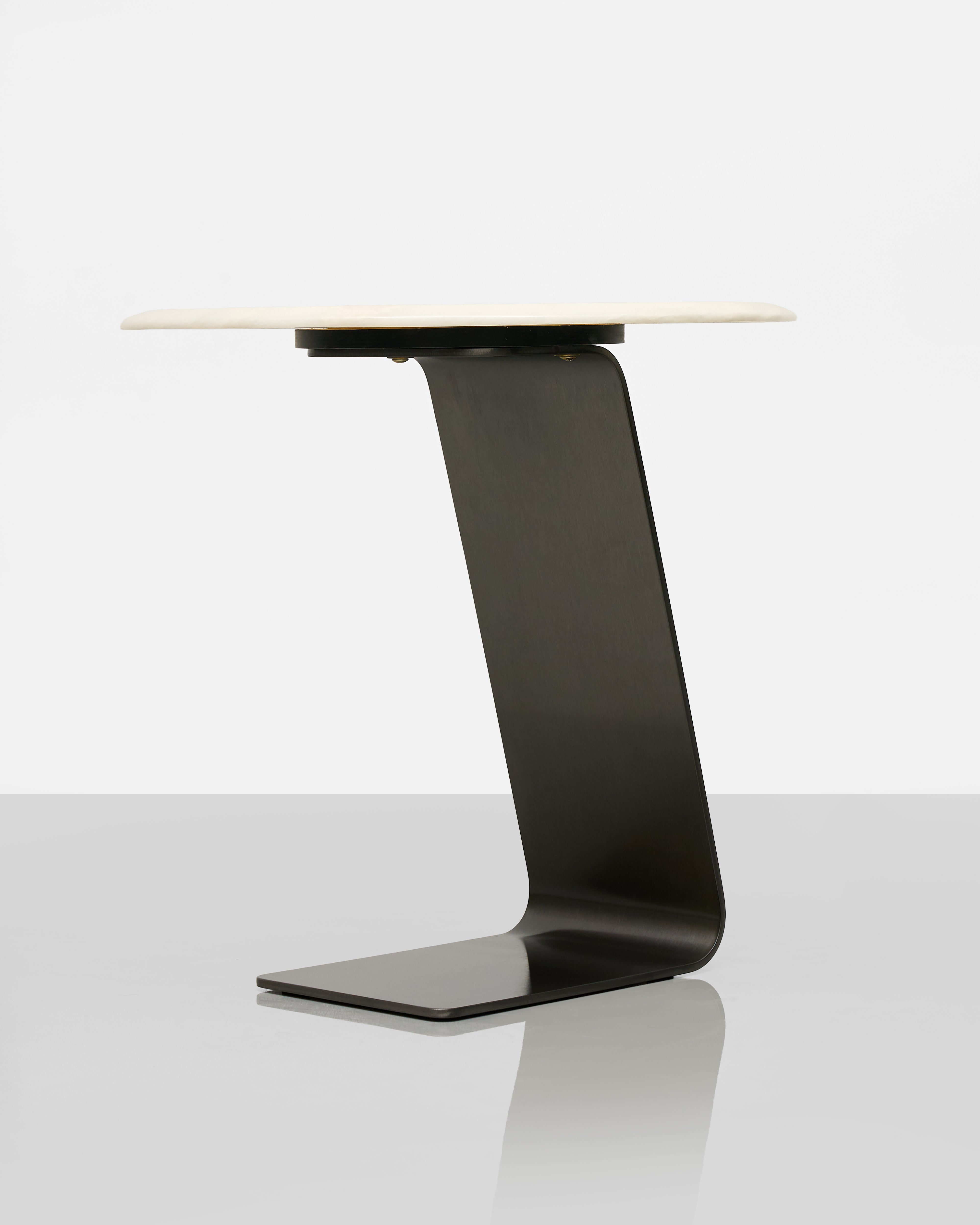 Modern black side table with a light wood top on a white background