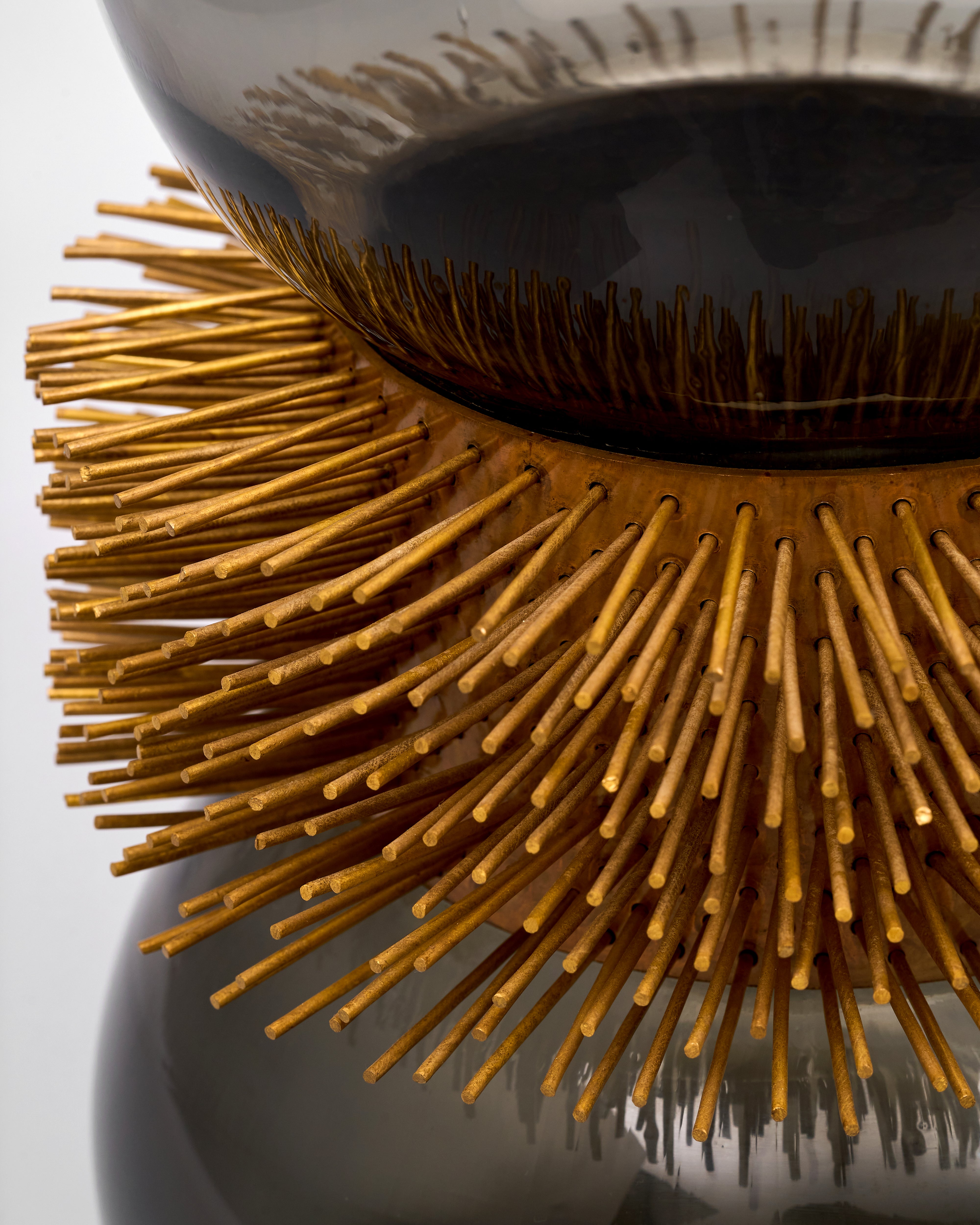 Close-up of a copper design on glass bowl with a white background