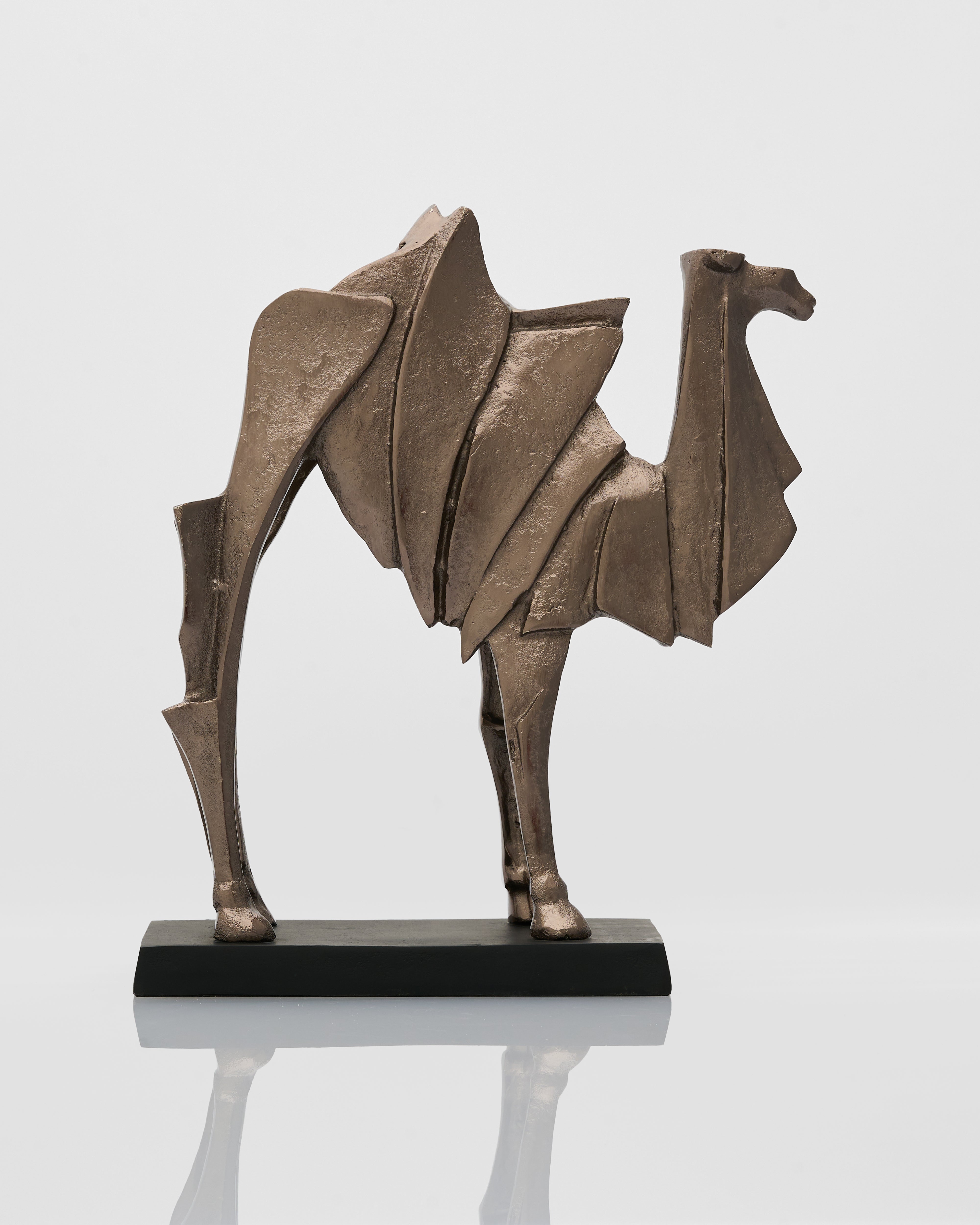 Bronze sculpture of a camel sculpture creature on a reflective surface with a light gray background