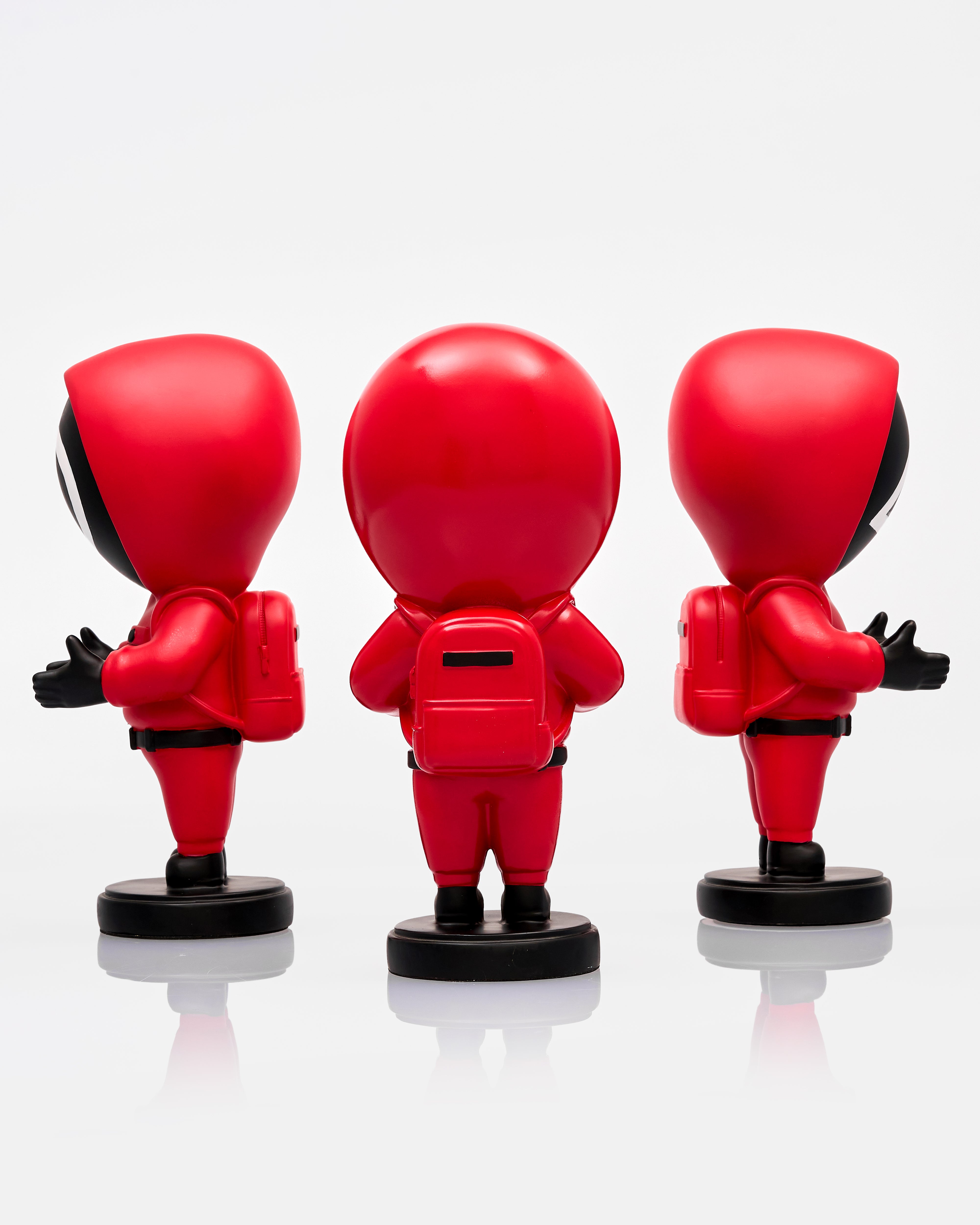 Three red superhero action figures of squid game series on a white background