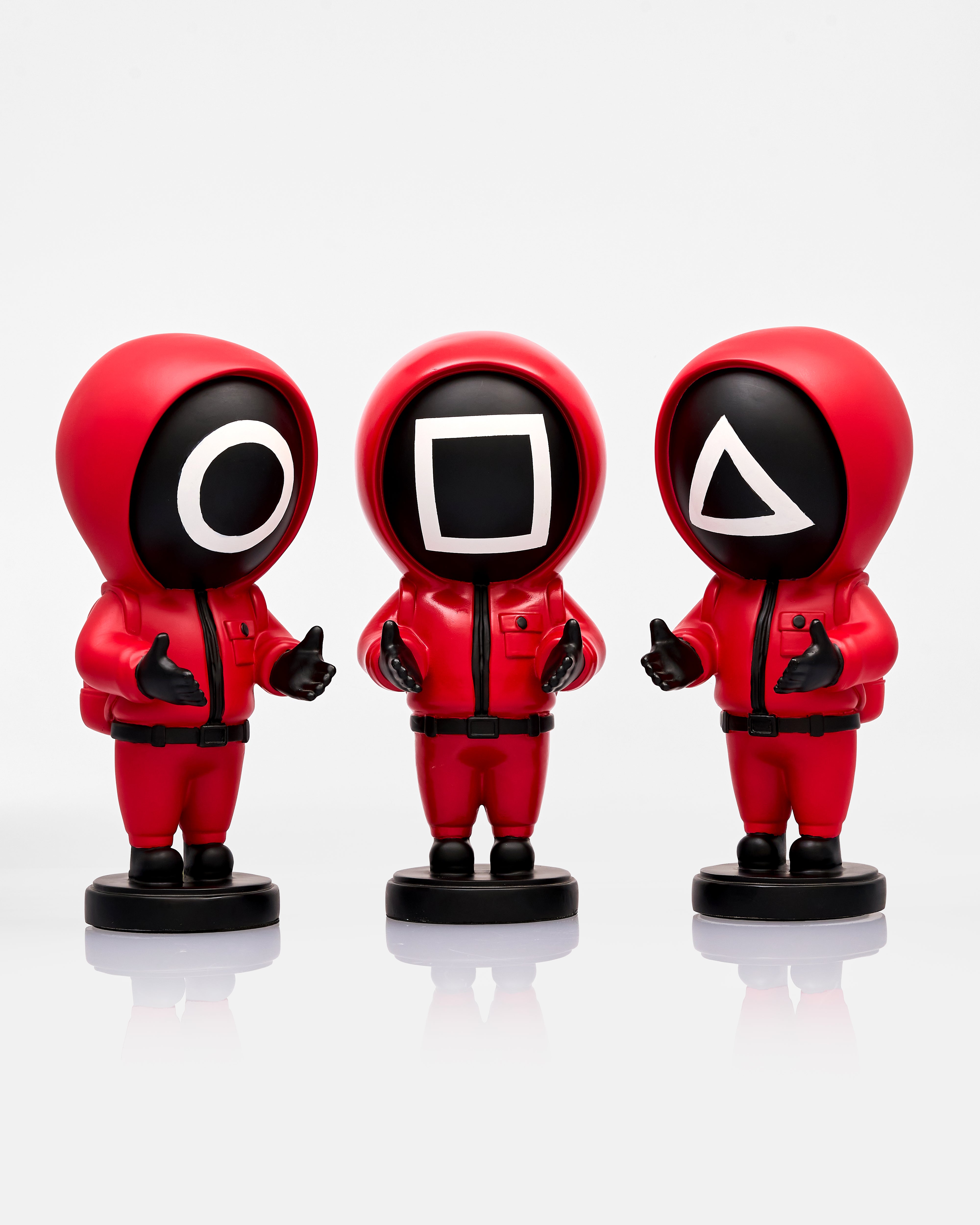 Three red hooded figures with different symbol face masks on a white background