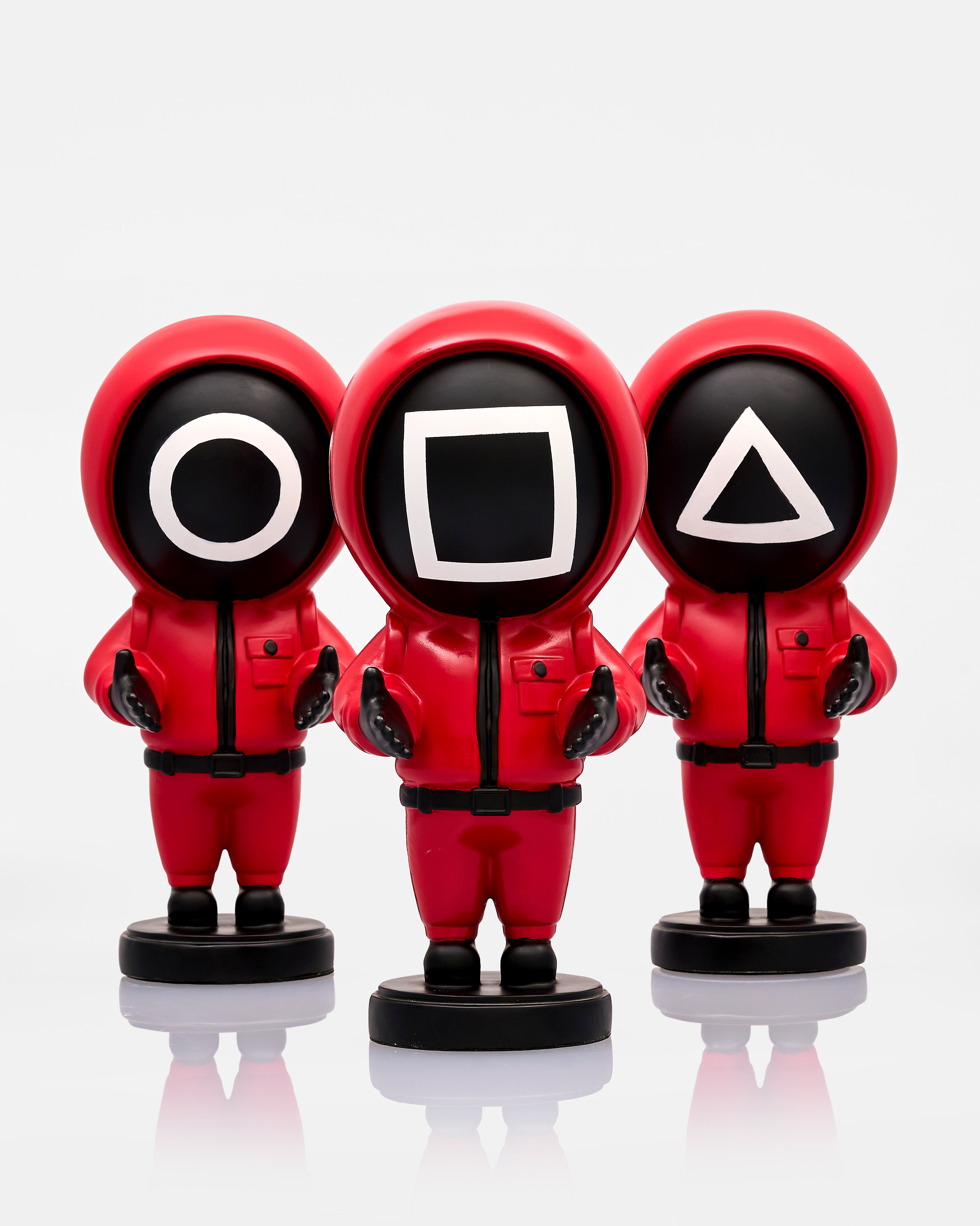 Three red figures with black and white symbol heads on a white background