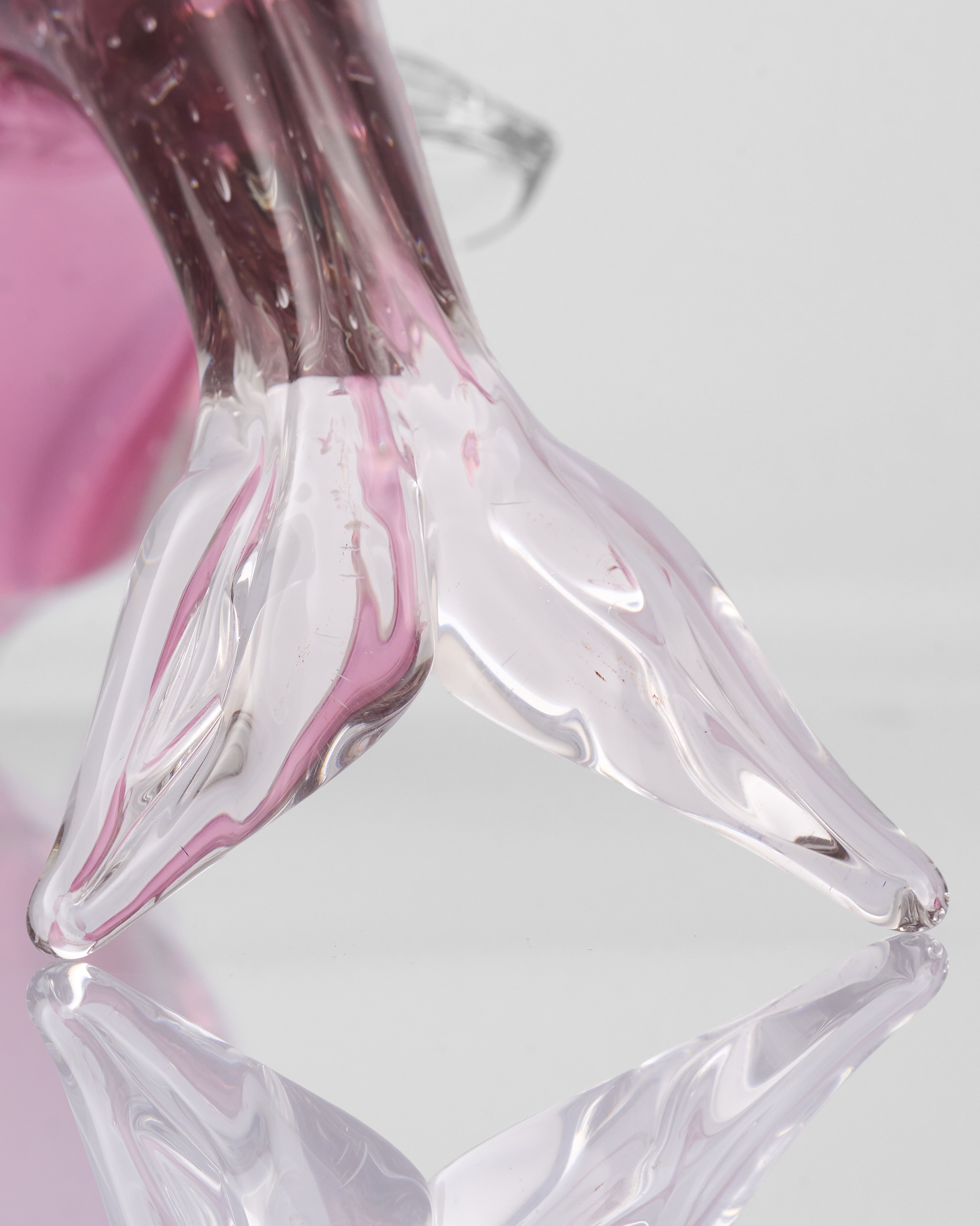 Close-up of a Crystal Glass Pink Fish Decor  with pink and clear design on a light background