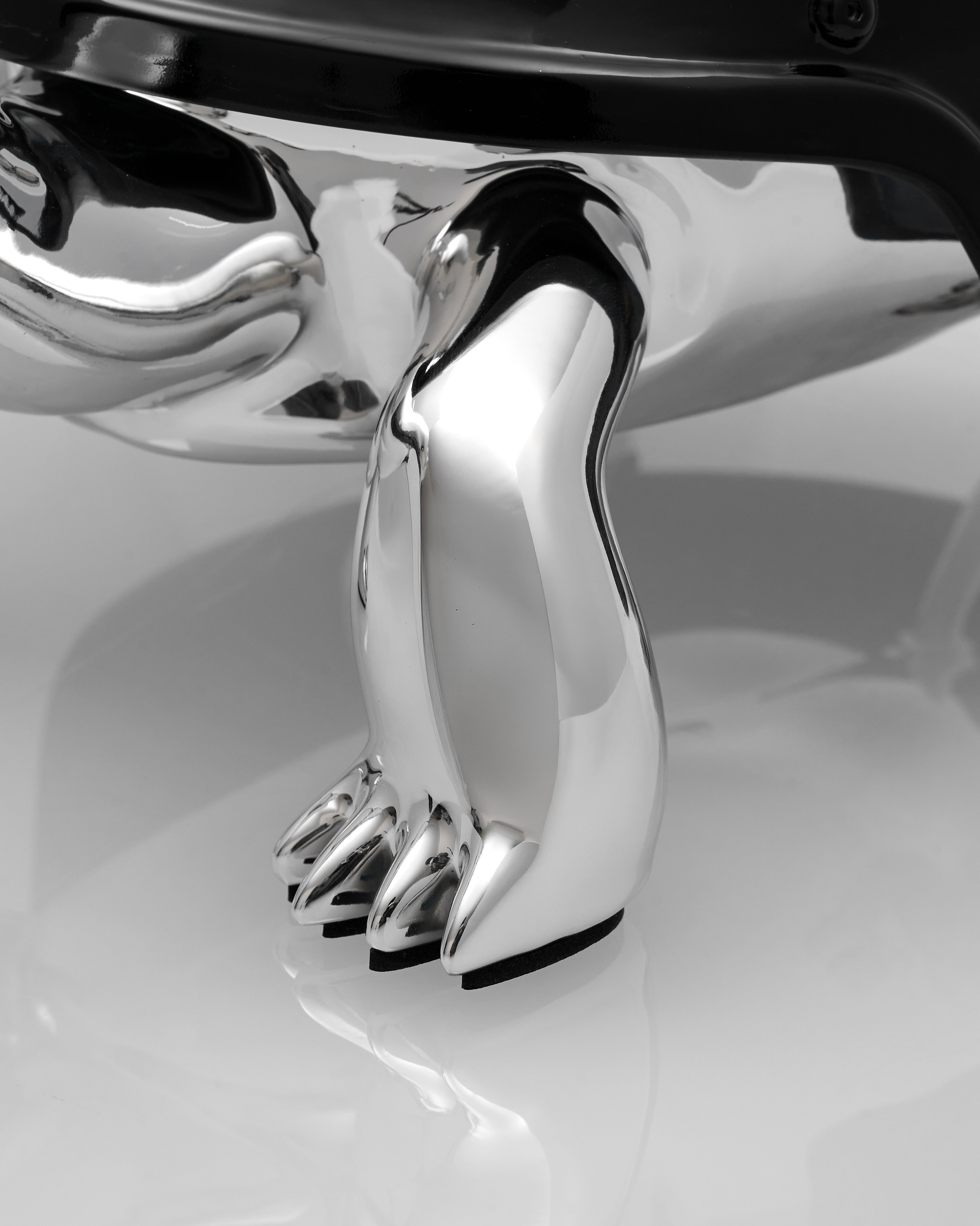 Chrome car emblem shaped like a paw  of Elite Sigil Turtle Decor