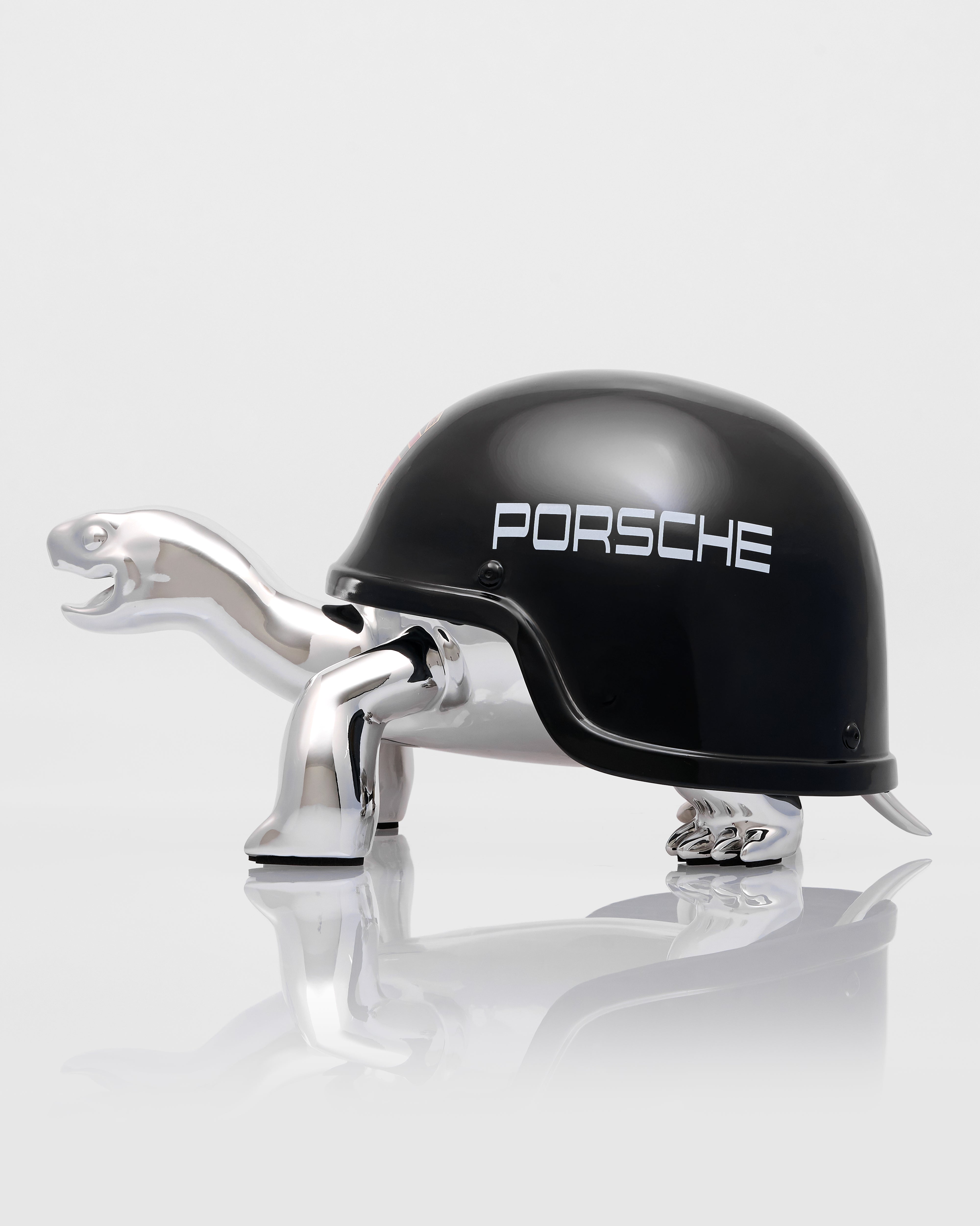 Black helmet with Porsche logo on a white background