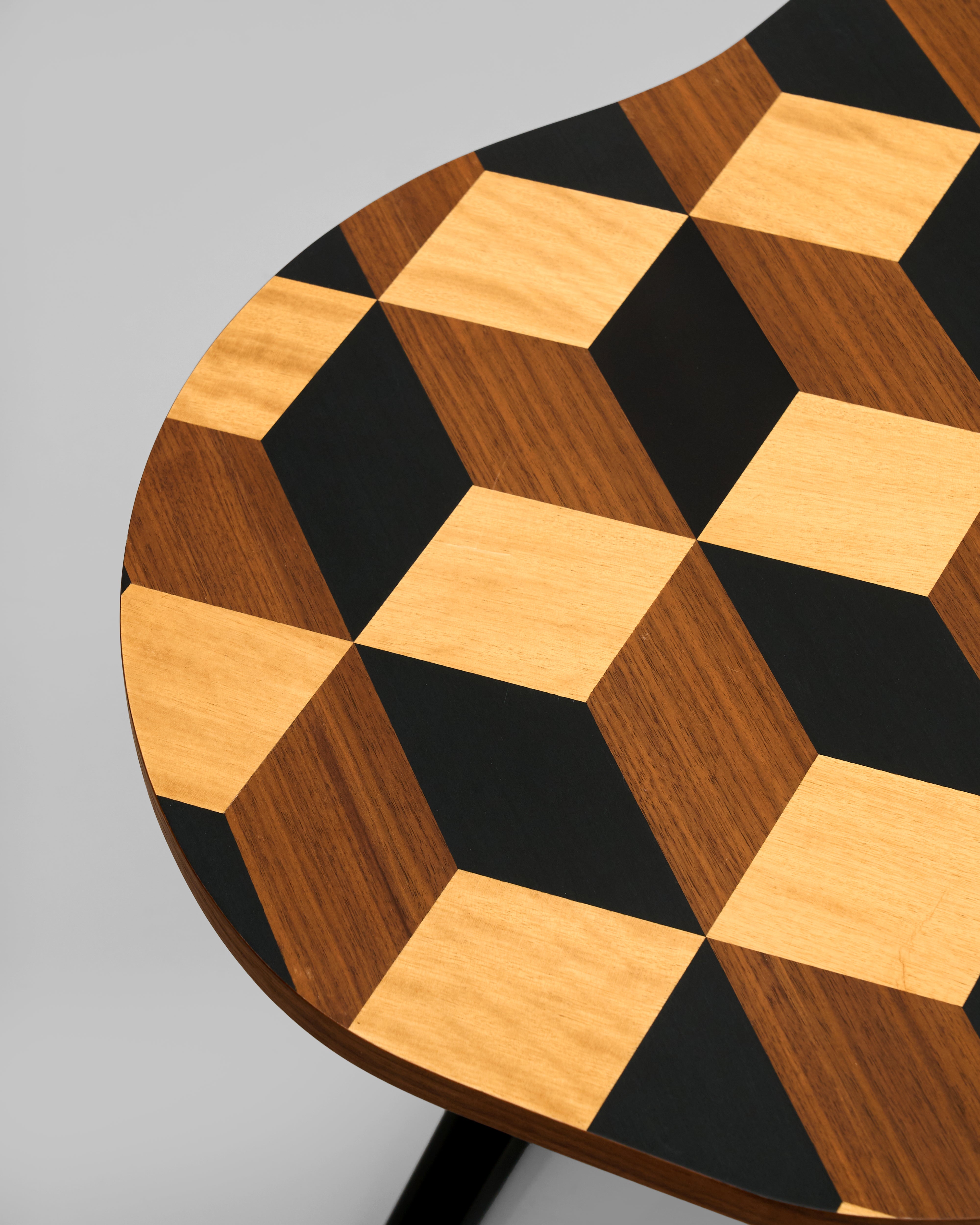 Wooden stool with a checkered pattern on a gray background