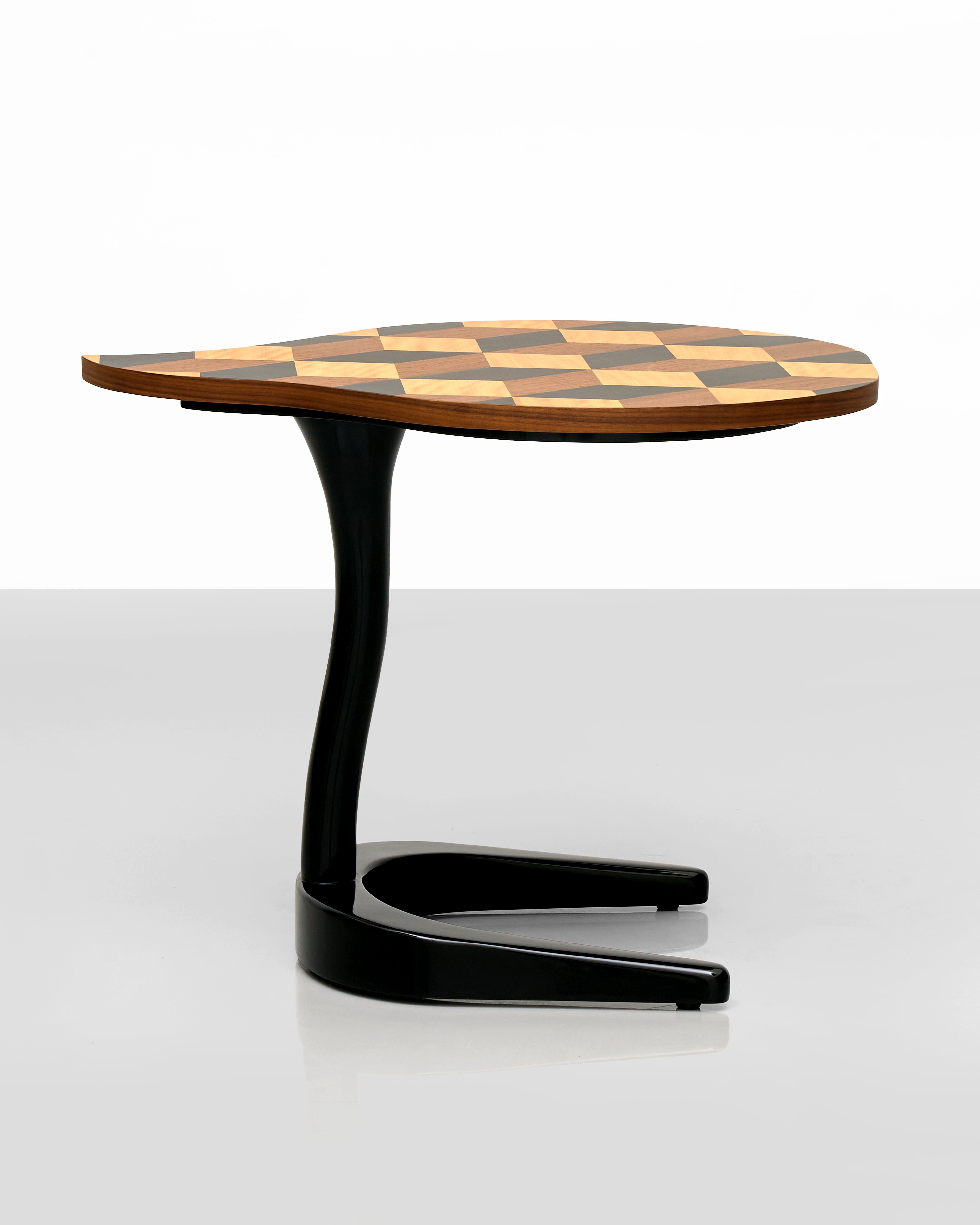 Side table with a checkered top and black base on a white background