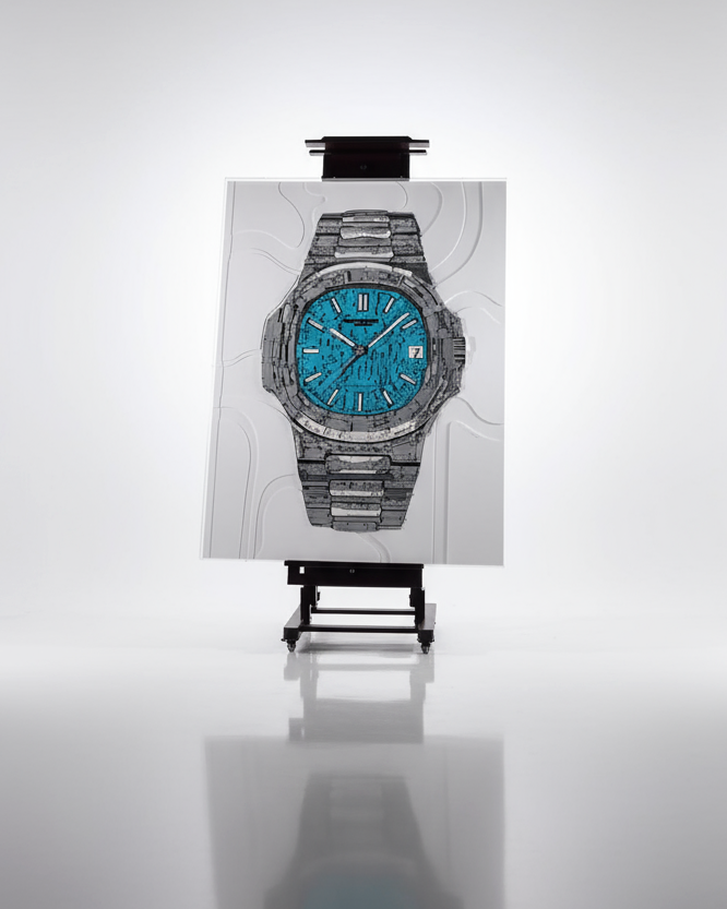 Luxury watch with blue face and silver case on a white background