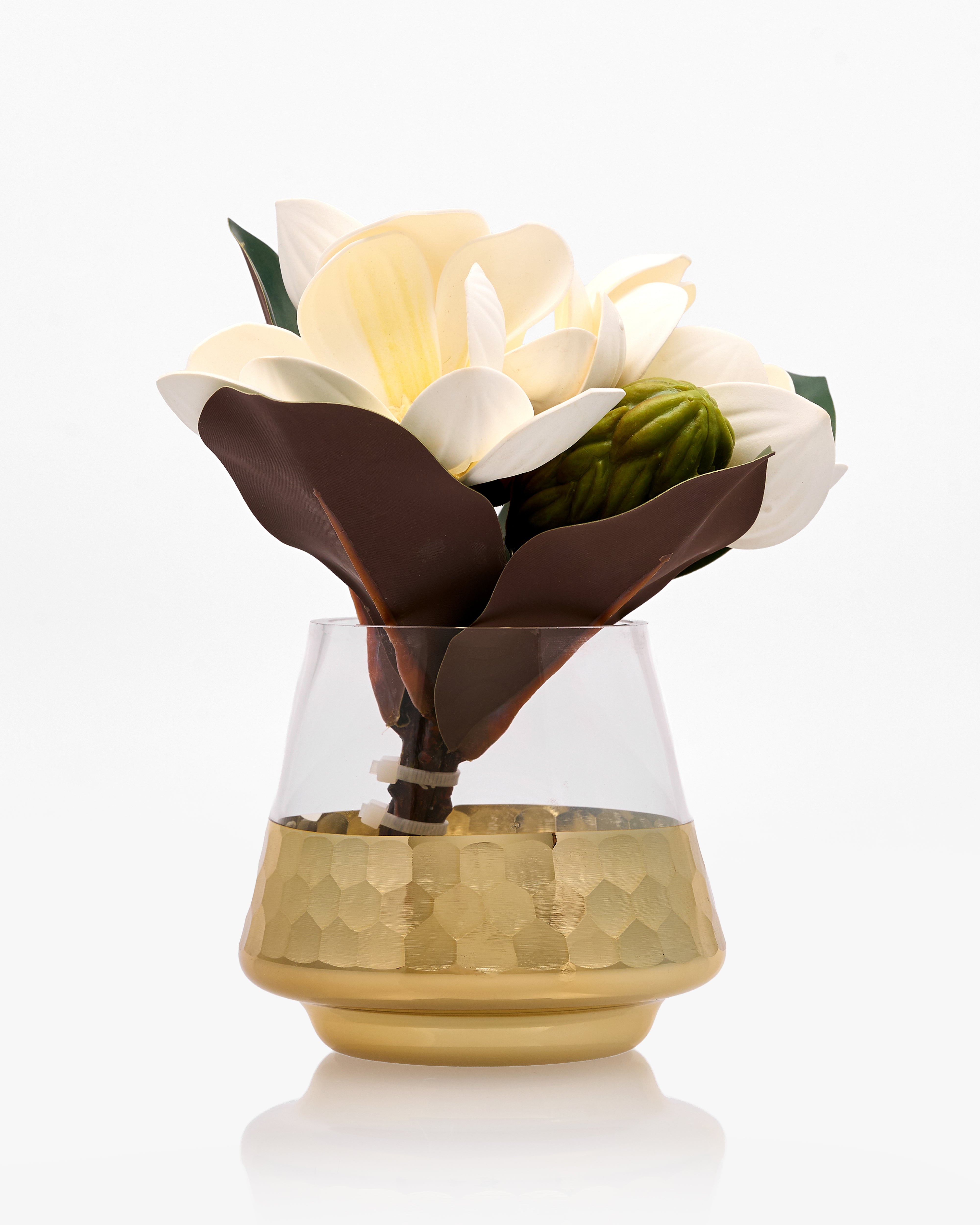 Decorative flower arrangement in a glass vase with a gold base on a white background