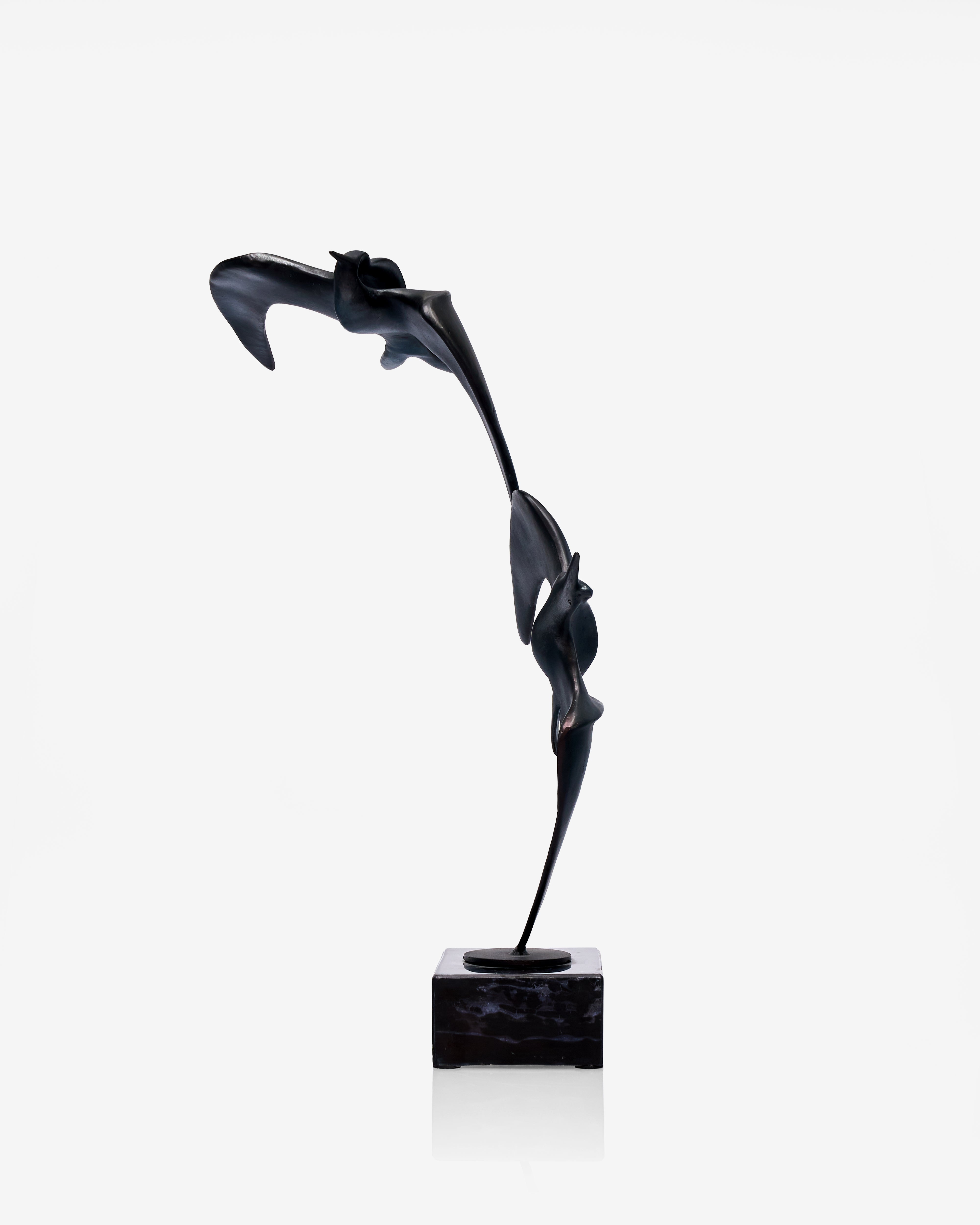 Abstract black birds sculpture on a white background