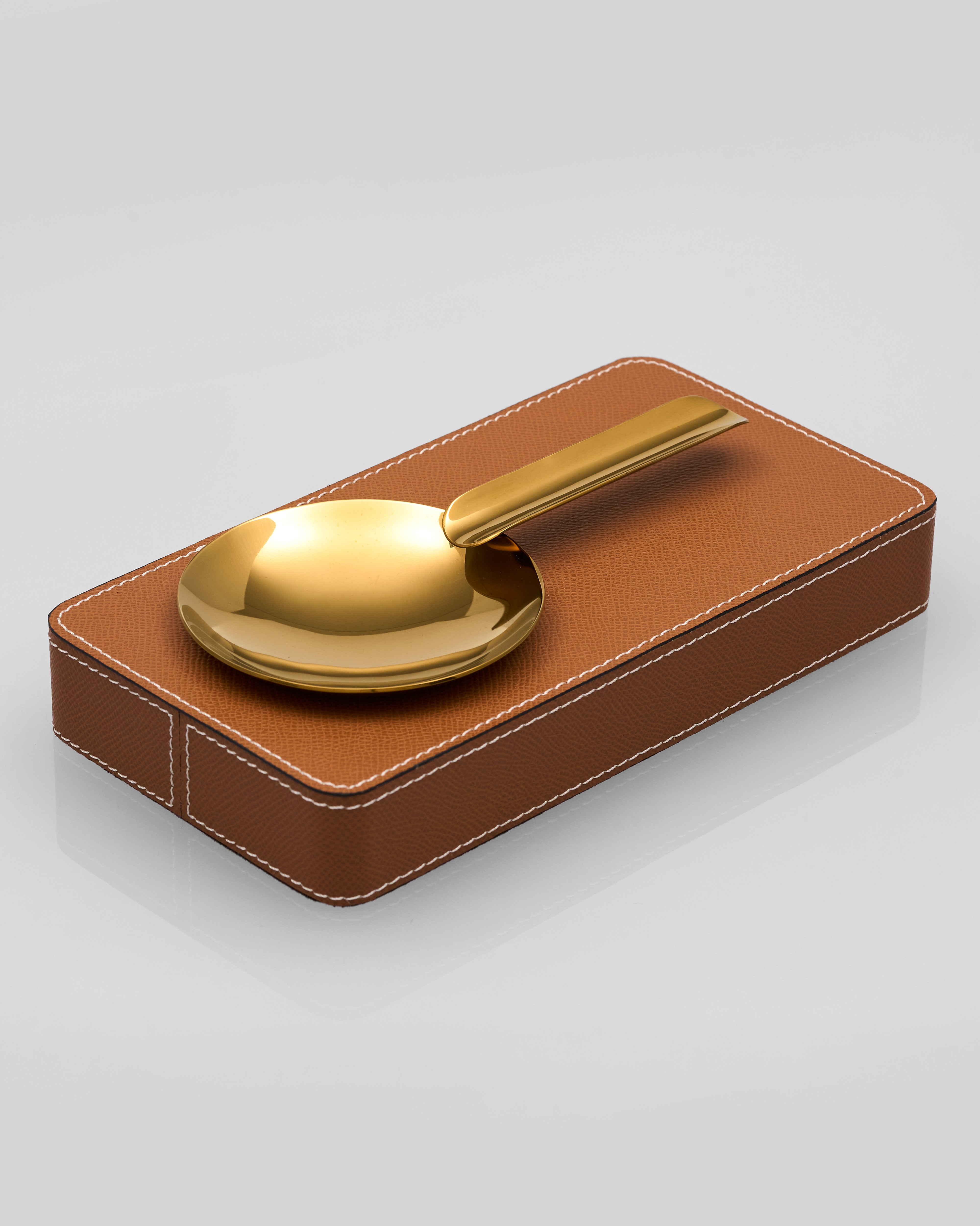 Gelo Leather Ashtray a brown leather case against a light gray background