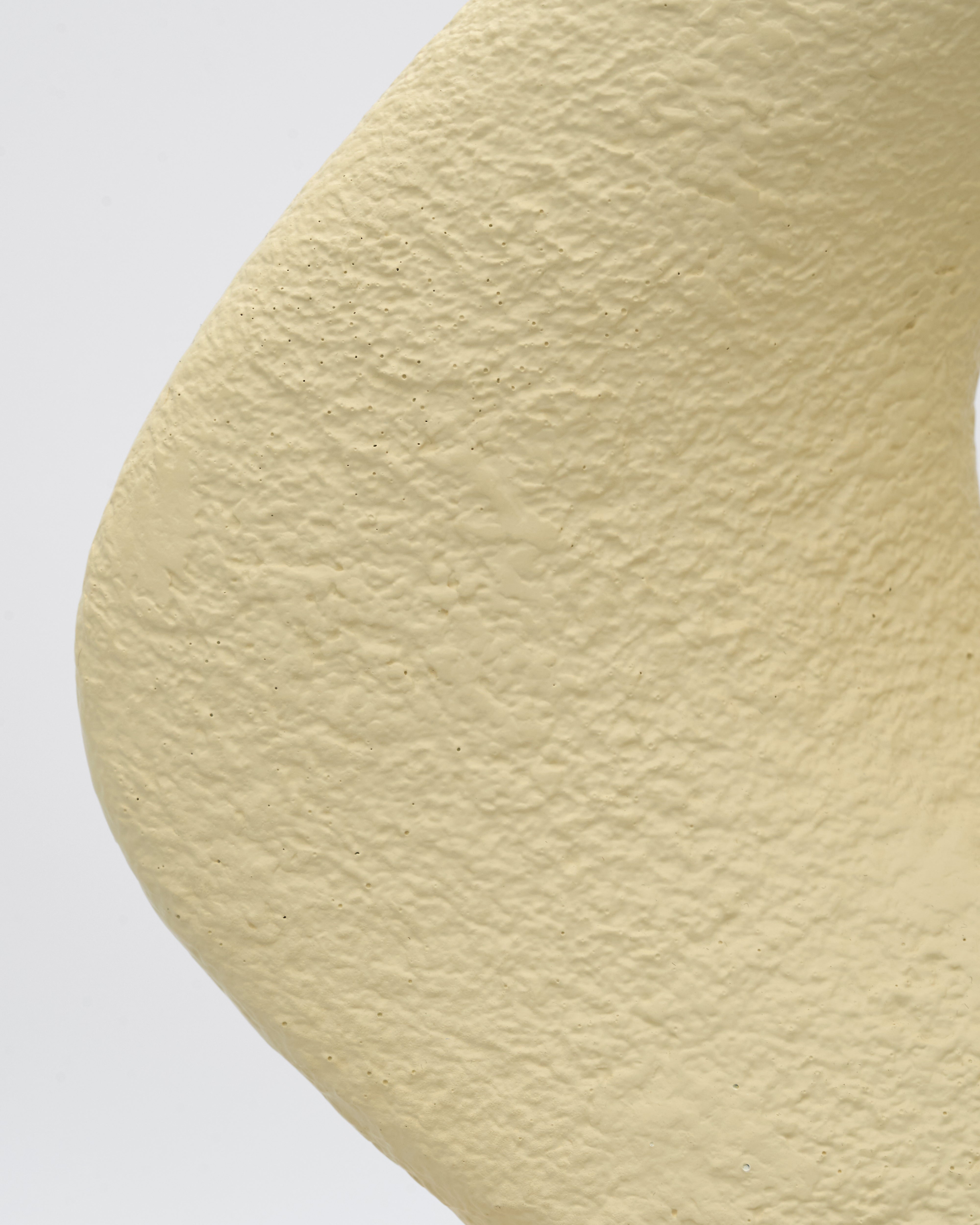 Close-up of beige yarn on a white background