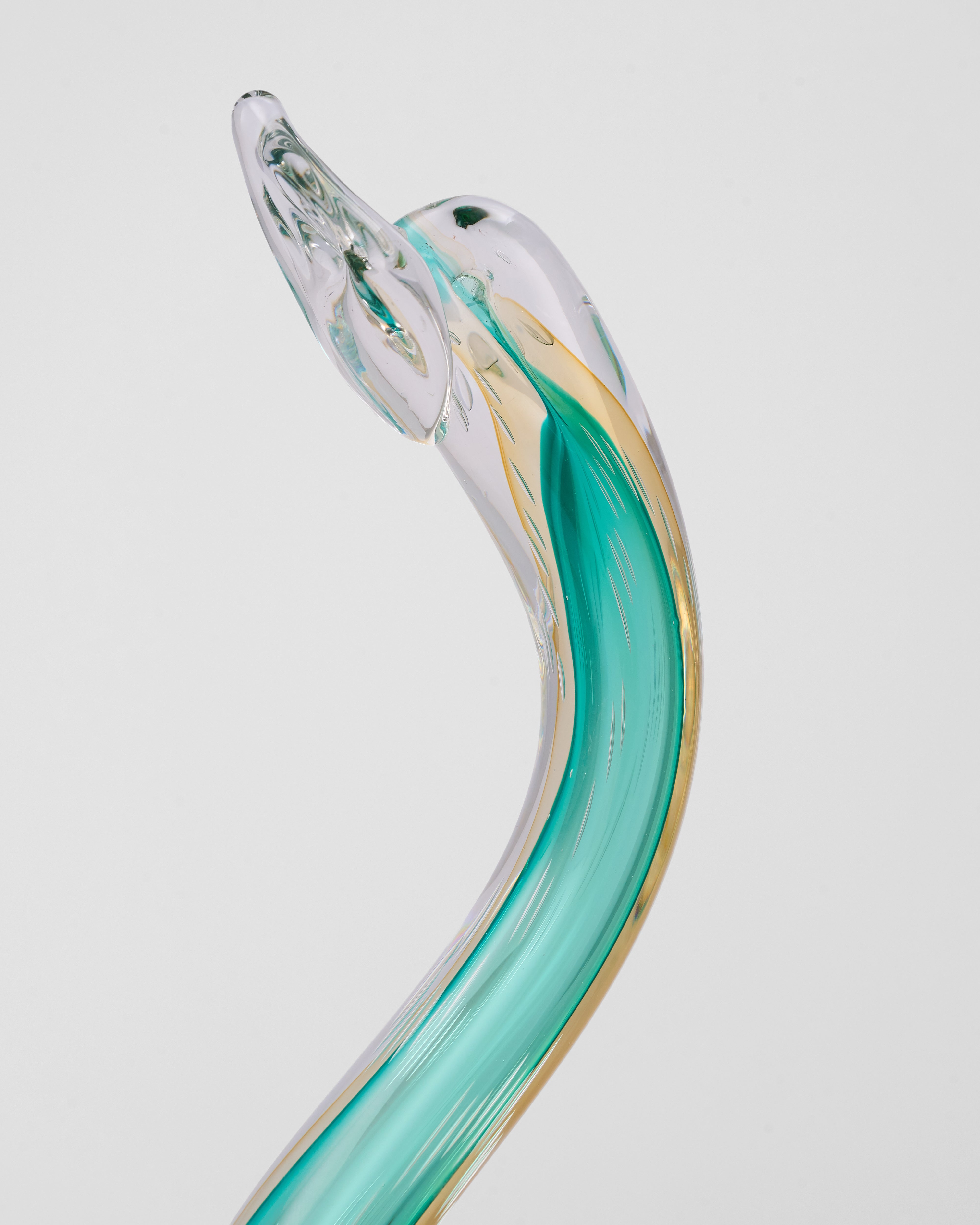 Green Swan Crystal Glass Decor with a curved design on a light gray background