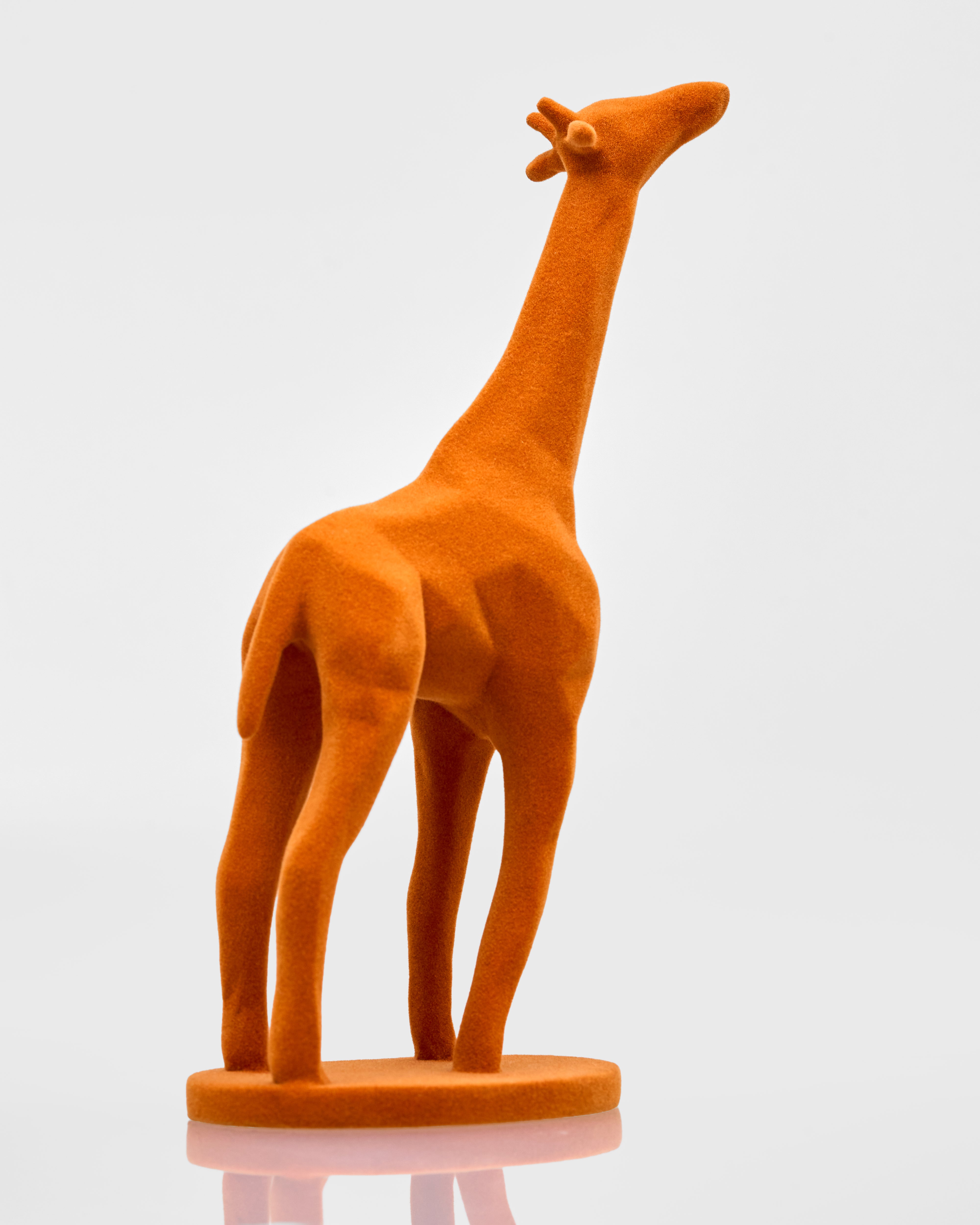 Plush giraffe toy on a white background