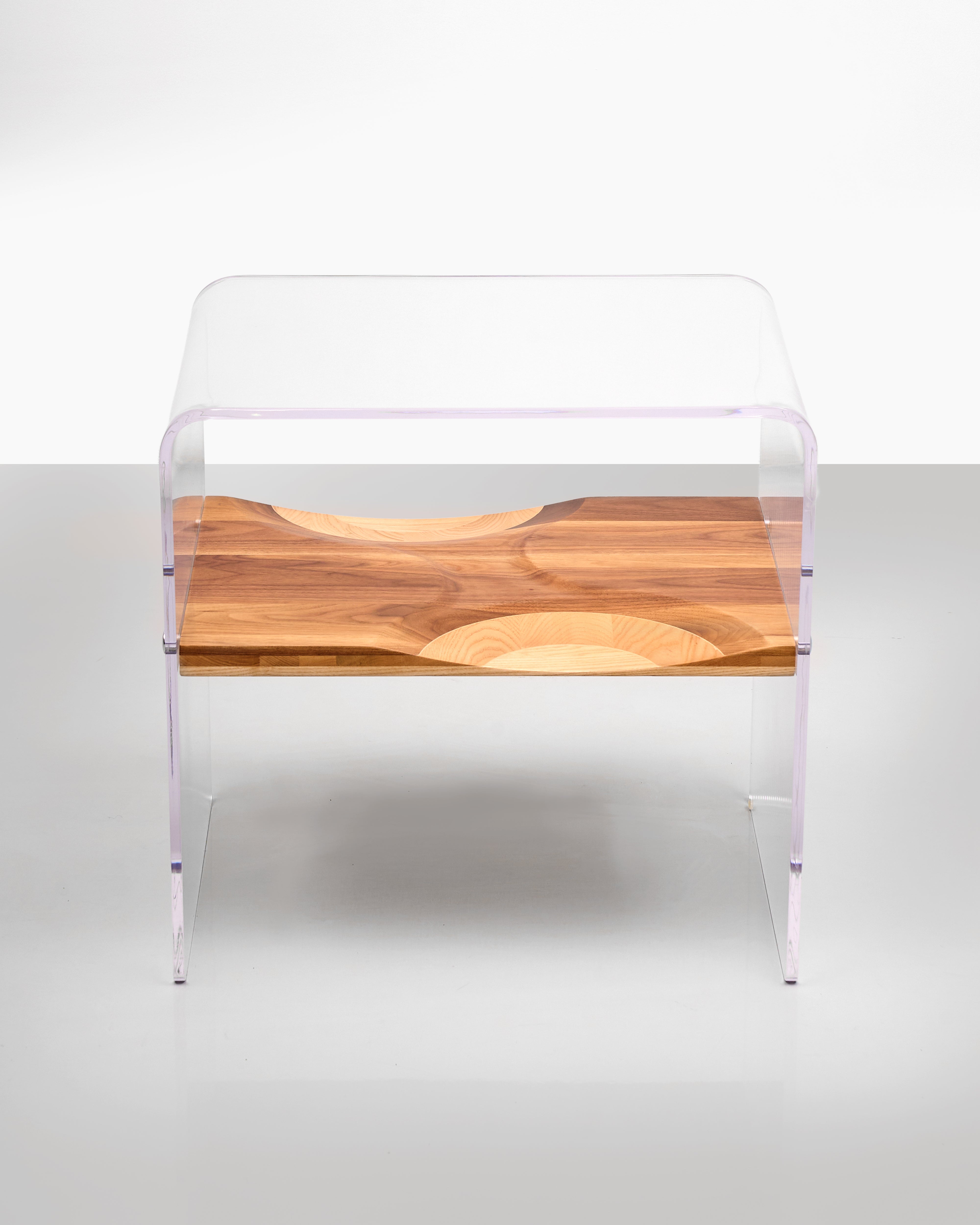 Modern chair with wooden seat and transparent backrest on a white background