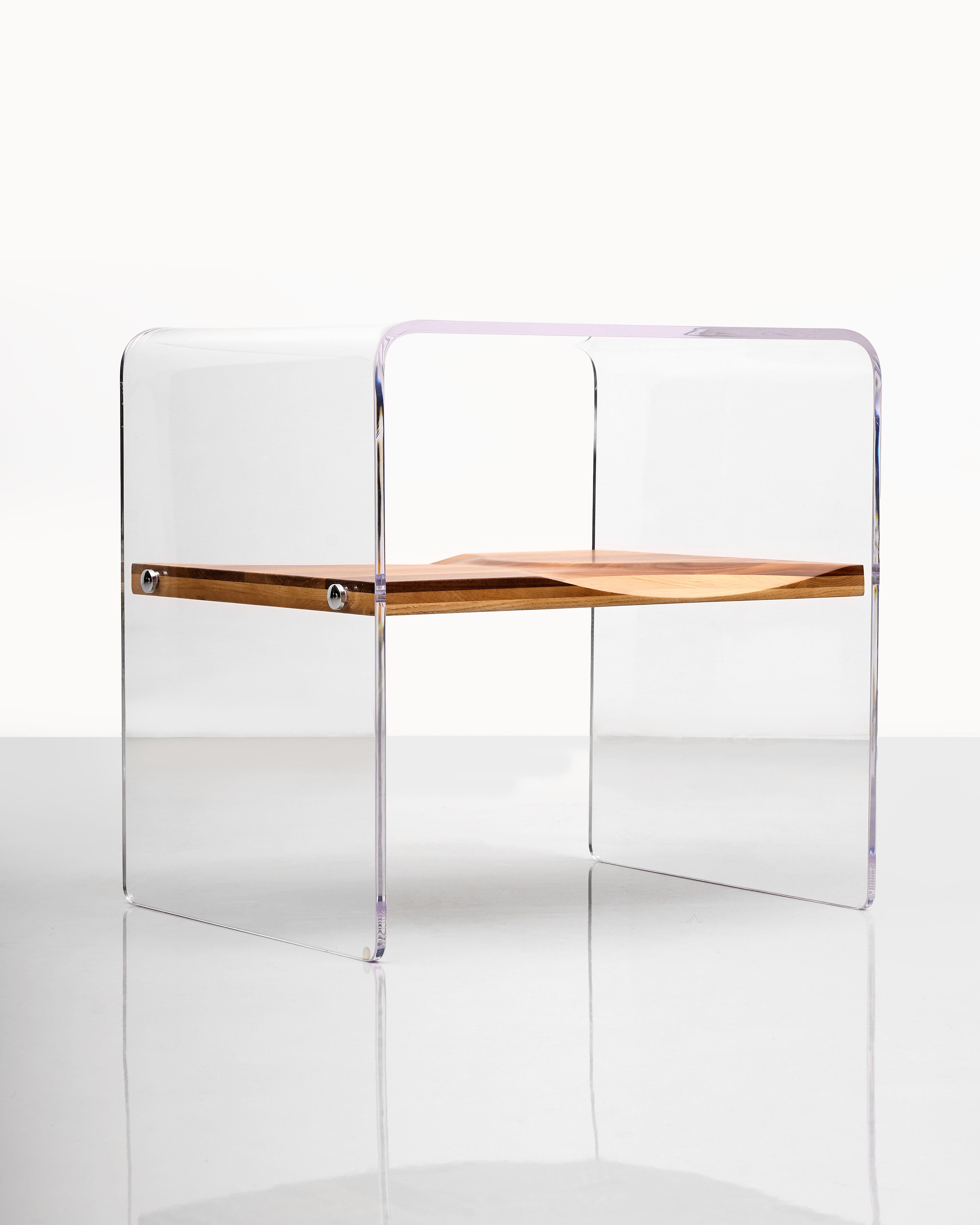 Clear acrylic chair with wooden seat on a white background