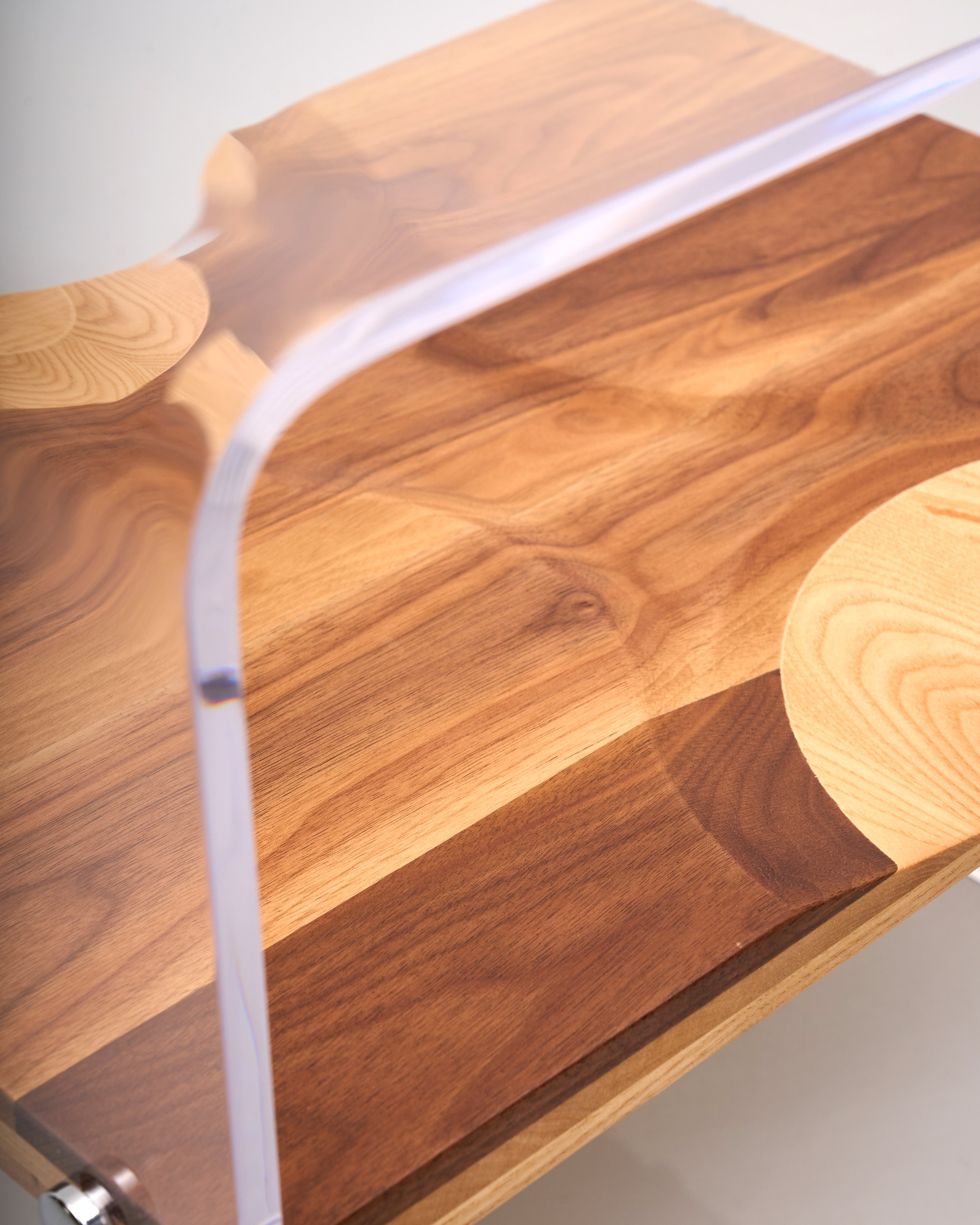Wooden desk with curved design on a white background