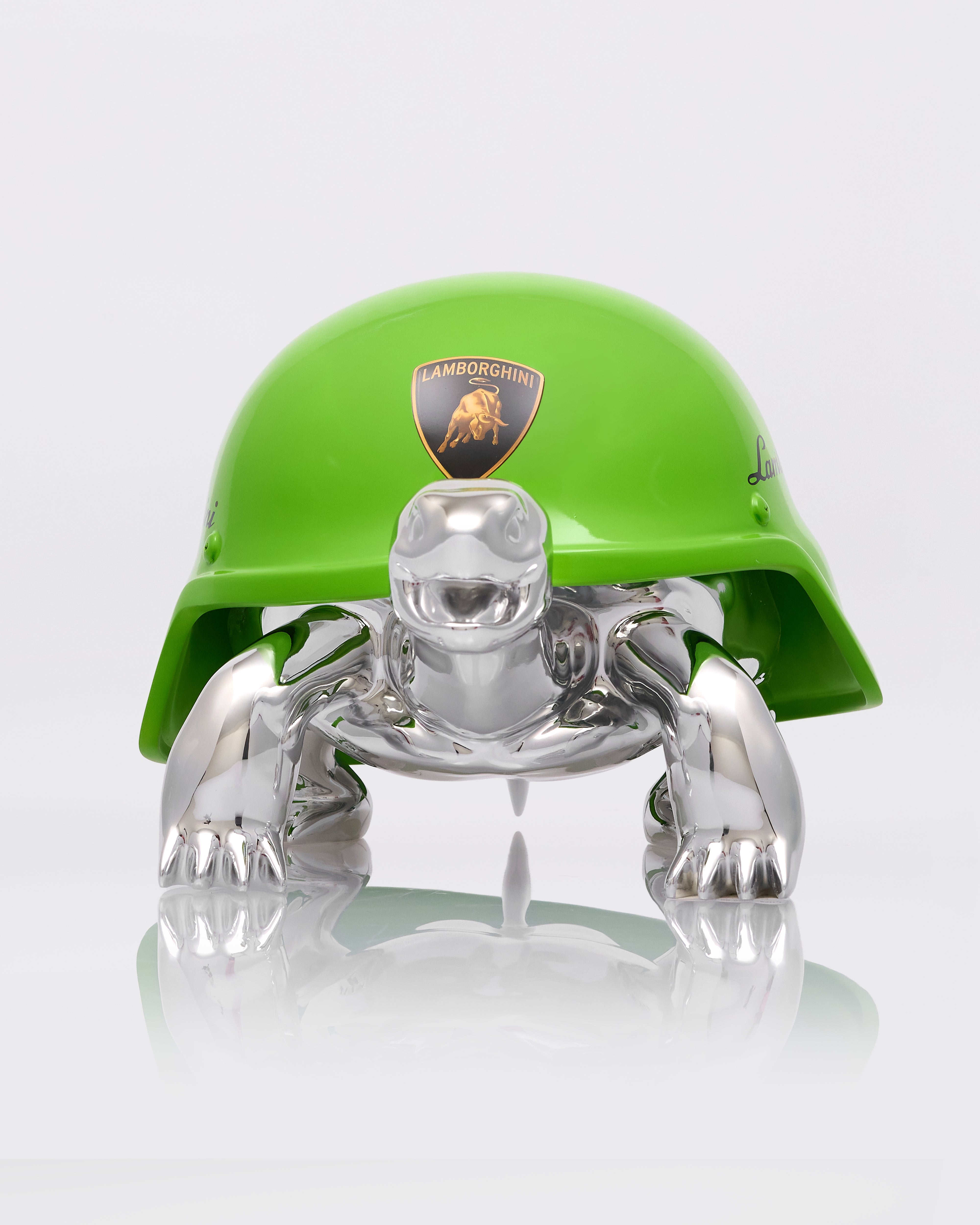 Green helmet with a Lamborghini logo and a clear plastic figure underneath on a white background