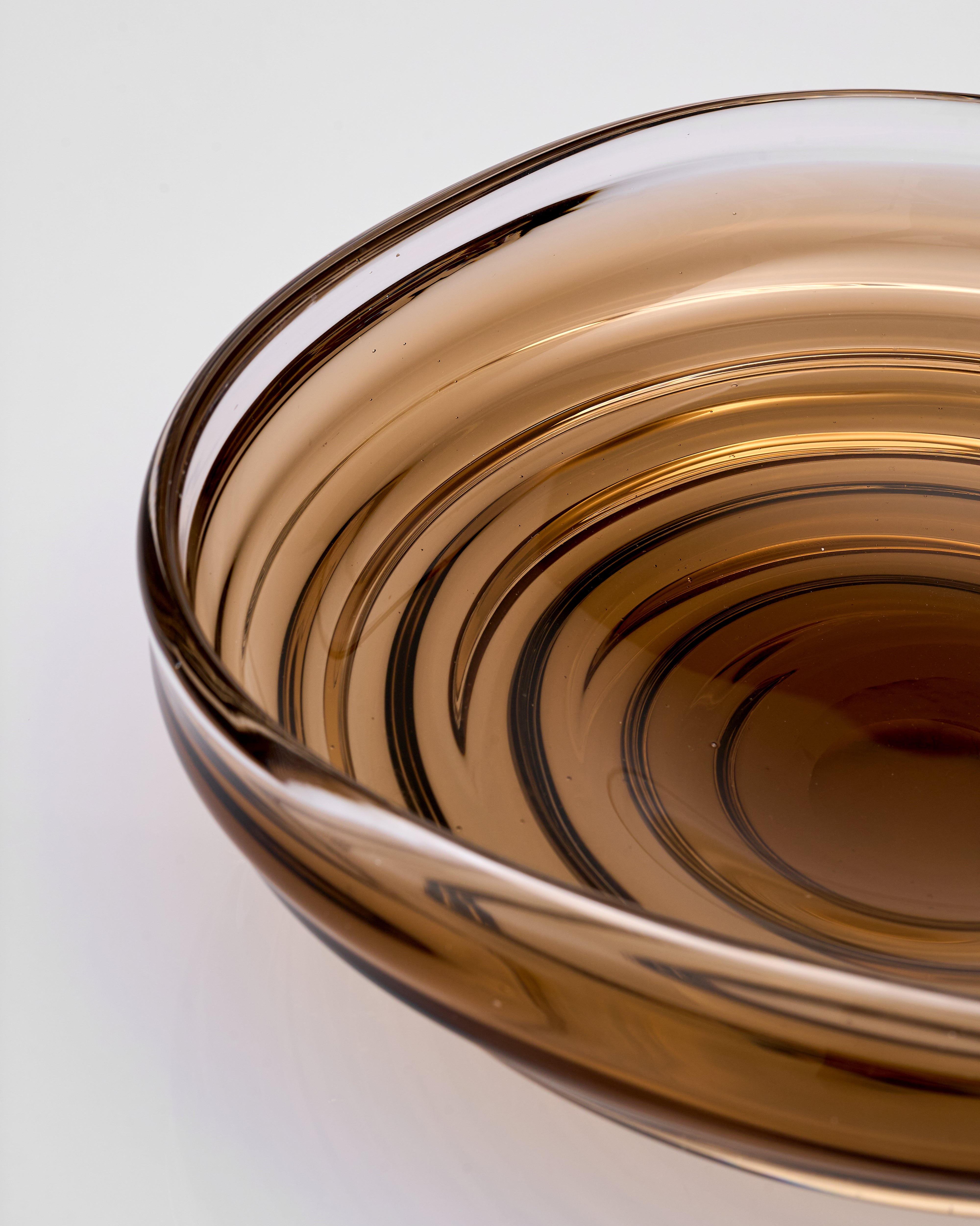 Brown glass bowl on a white background