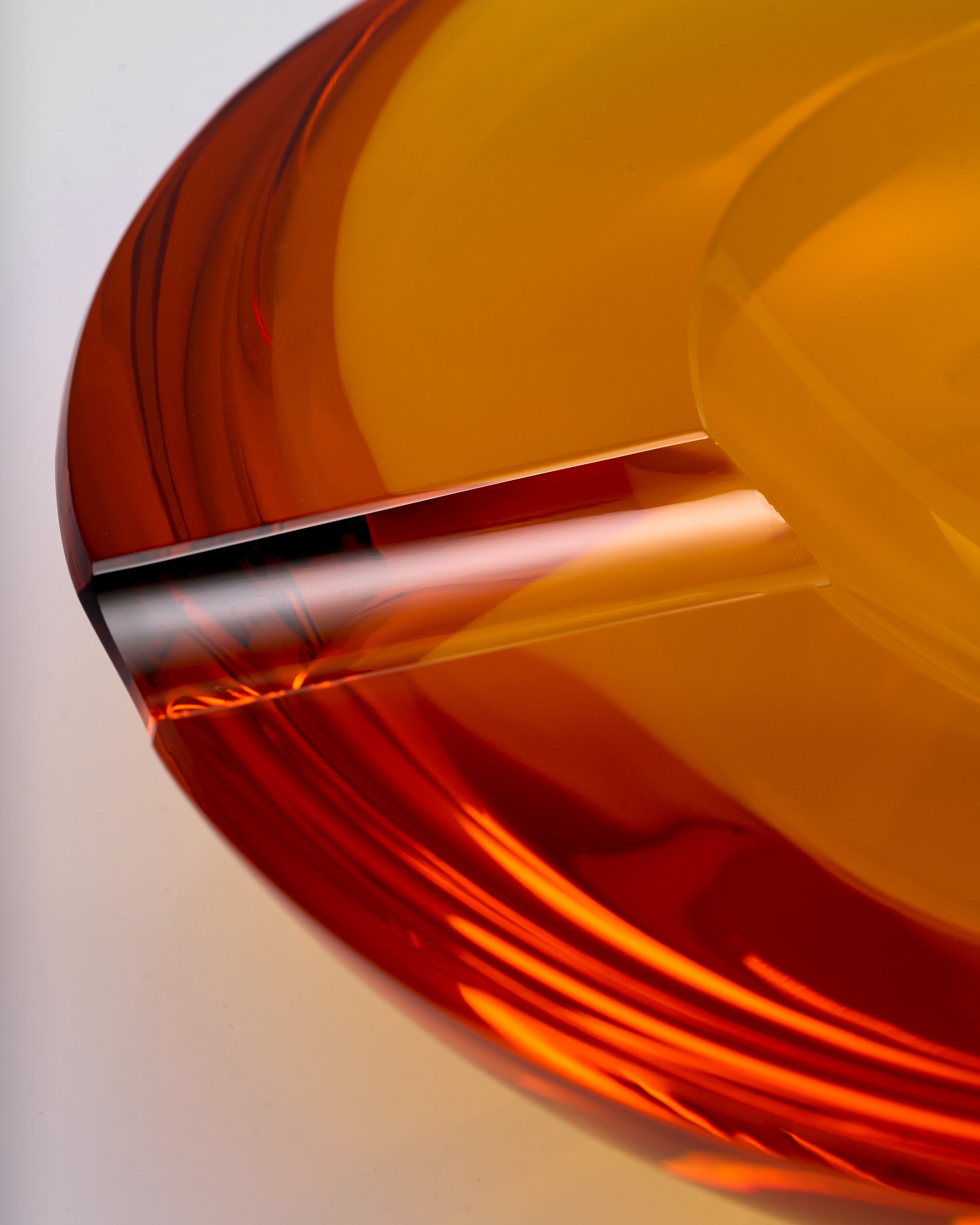 Close-up of a roll of orange crystal glass ashtray material