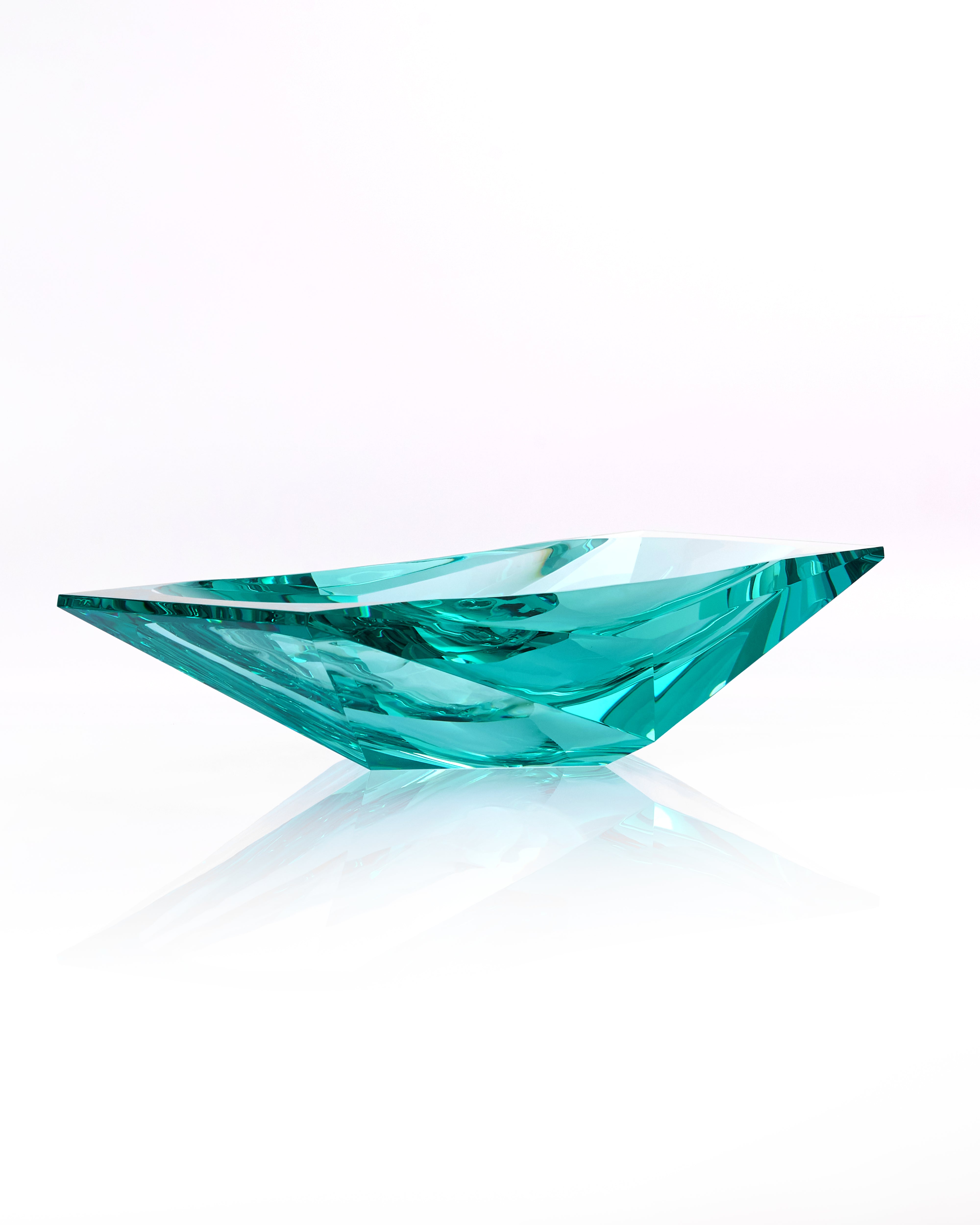Teal crystal bowl on a white background