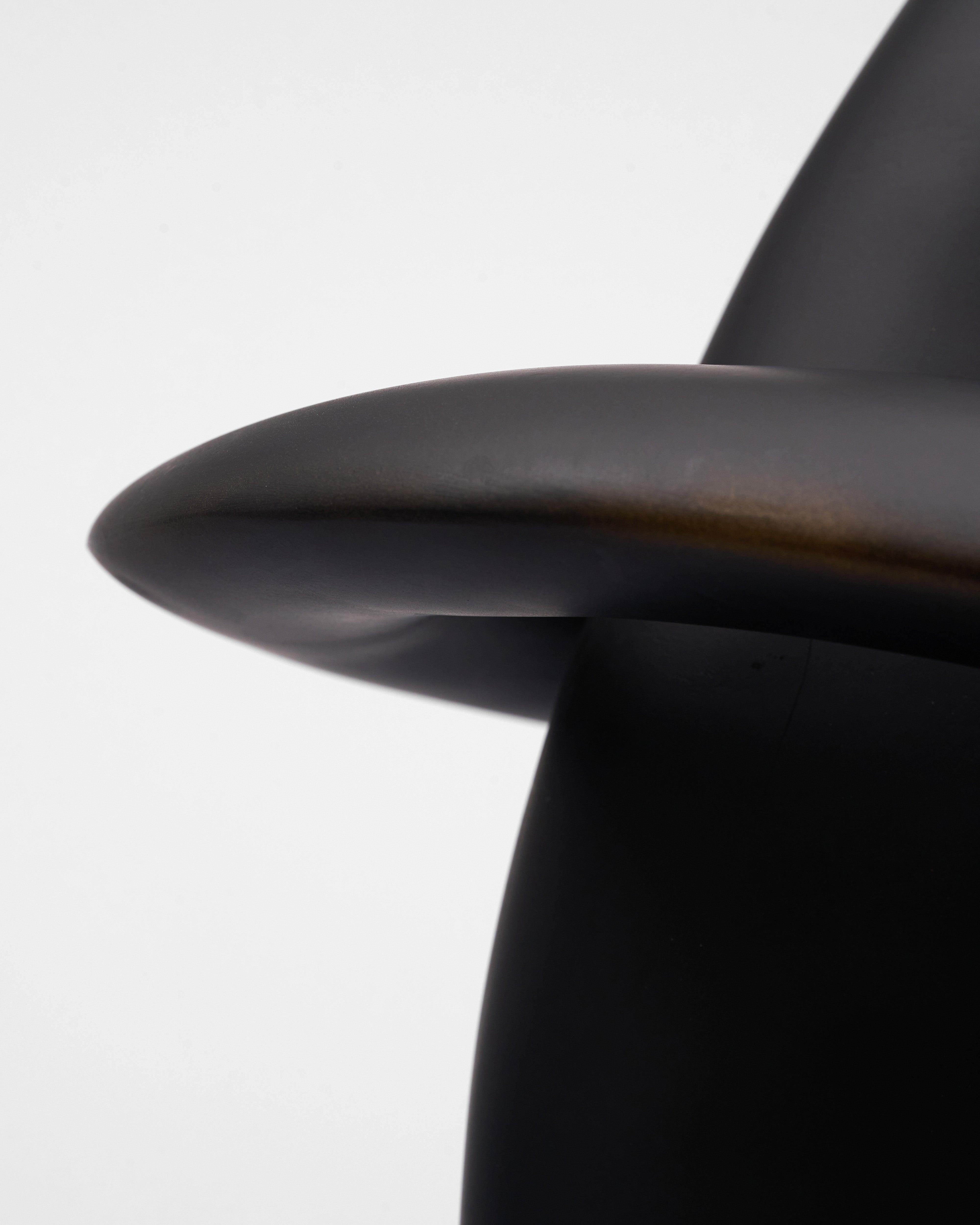 Close-up of a black chair with a blurred background