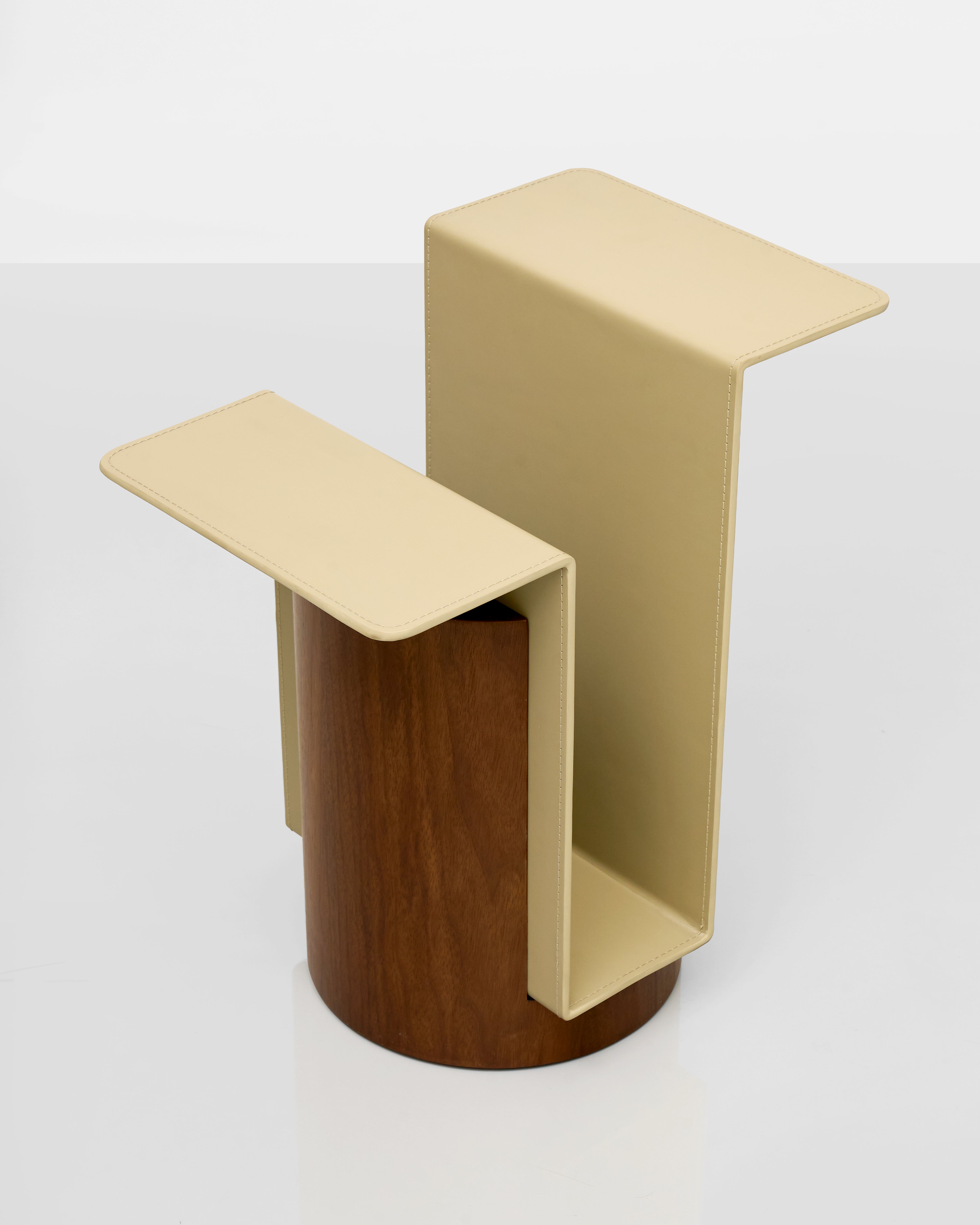 Two-tone side table with beige top and brown cylindrical base on a white background