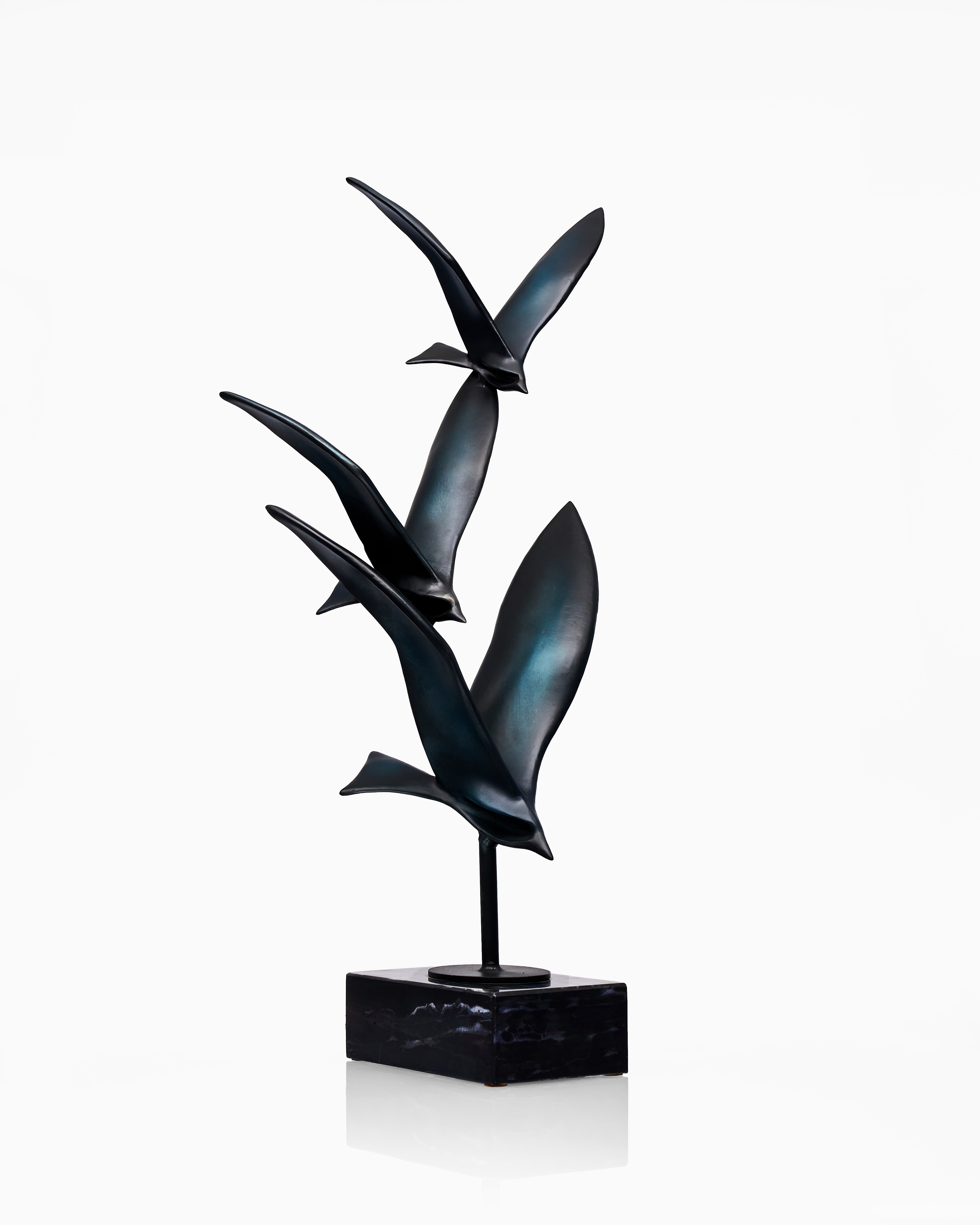 Abstract sculpture of birds on a white background