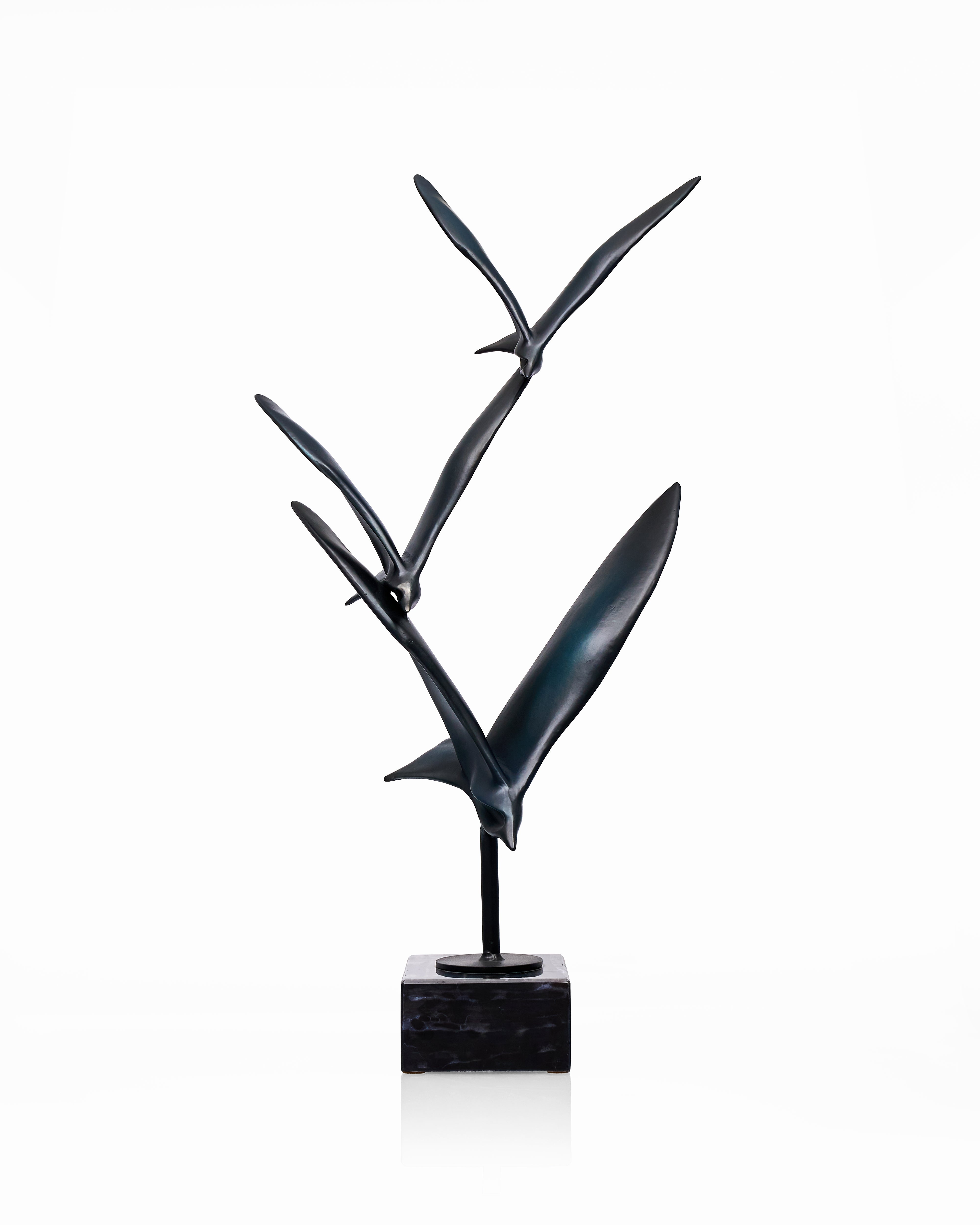 Black abstract sculpture on a white background