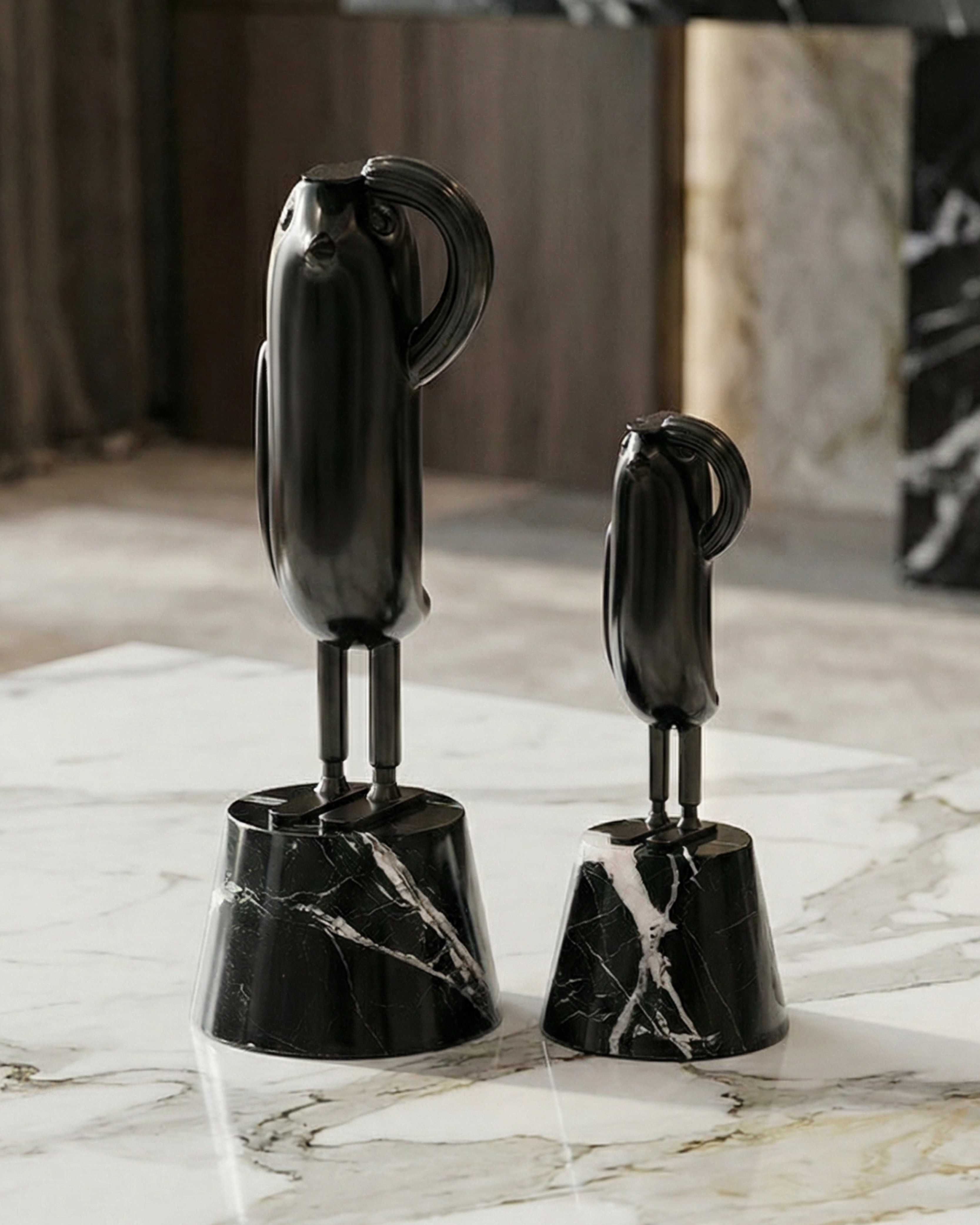 Two black marble sculptures